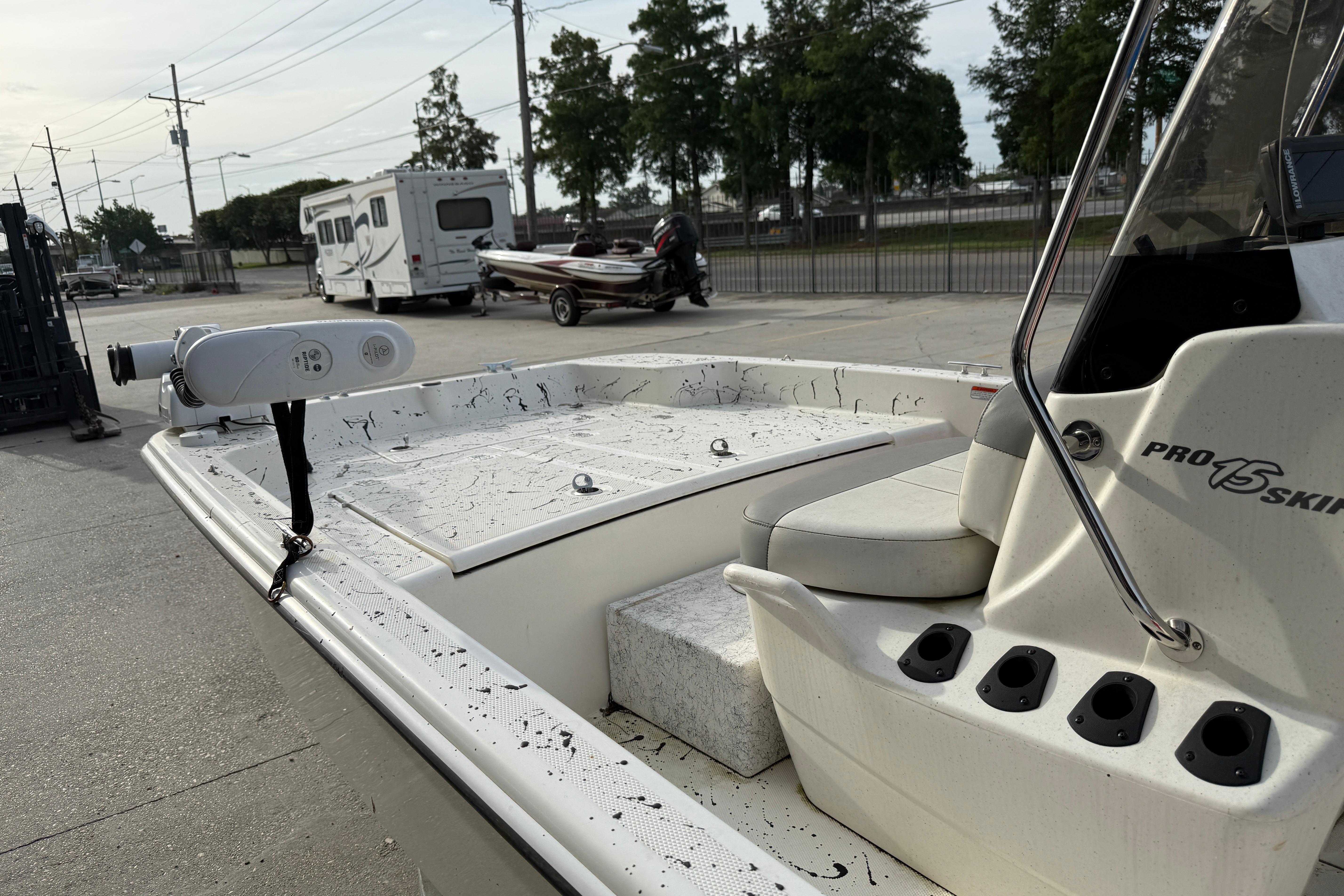 2020 Mako Pro Skiff 15 CC boat parked outdoors, featuring a clean deck and seating area.