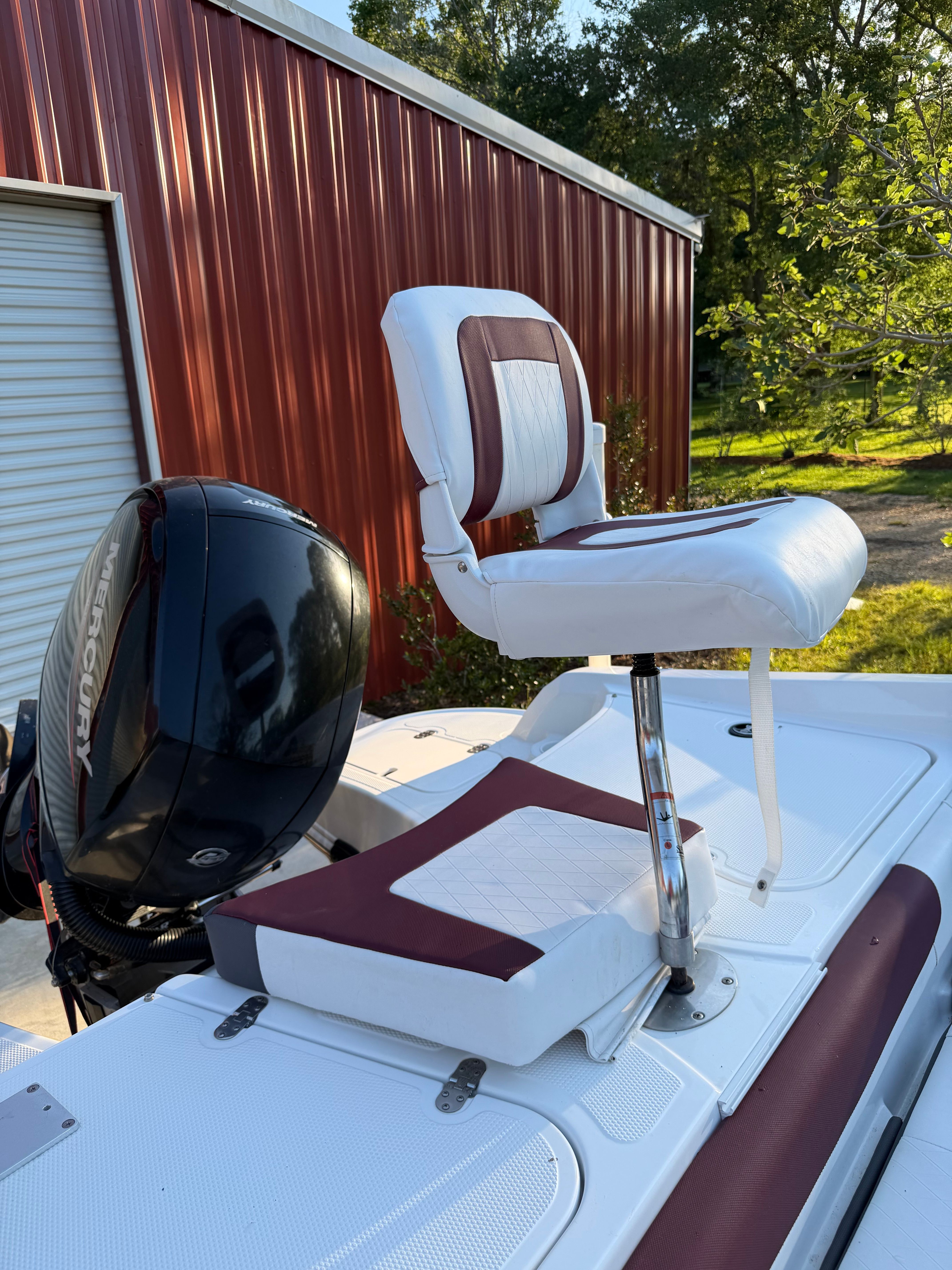 Tracker Tahoe 550TF 2020 with Mercury engine and seat on boat deck.
