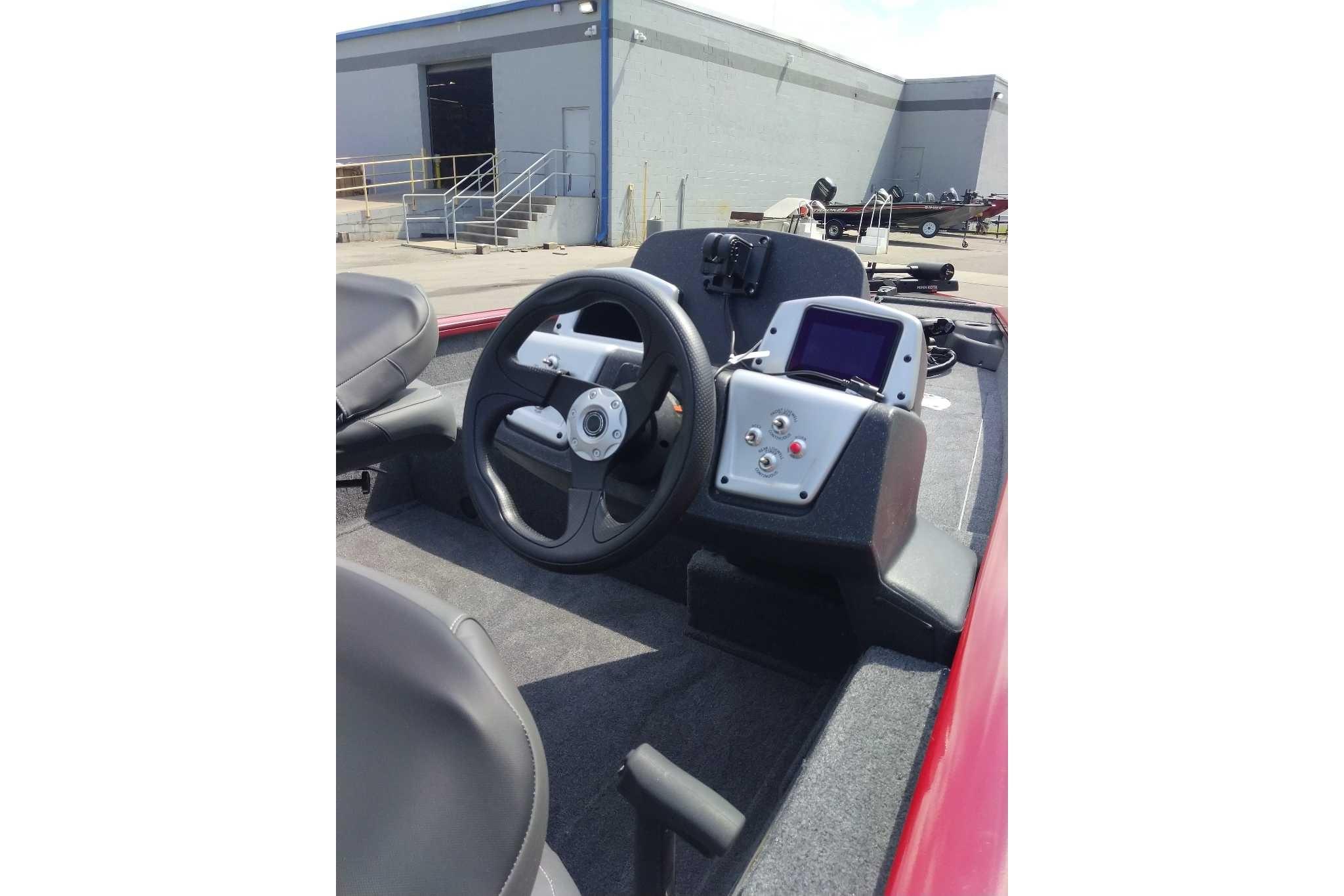 2026 Tracker Pro Team 175 Crappie Edition boat dashboard with steering wheel and control panel.