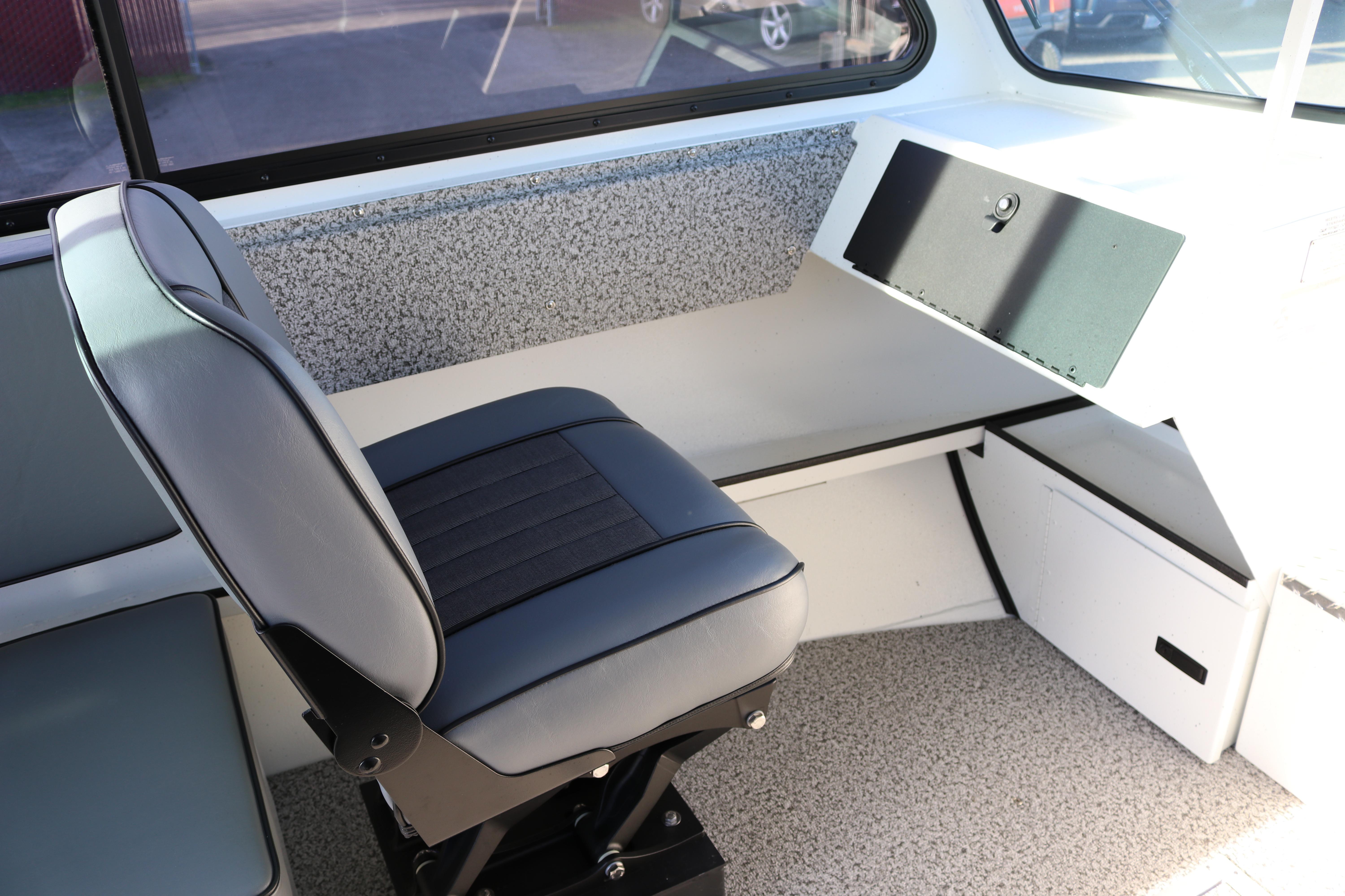 2026 Alumaweld Intruder Outboard 22 interior with sleek seating and modern dashboard.