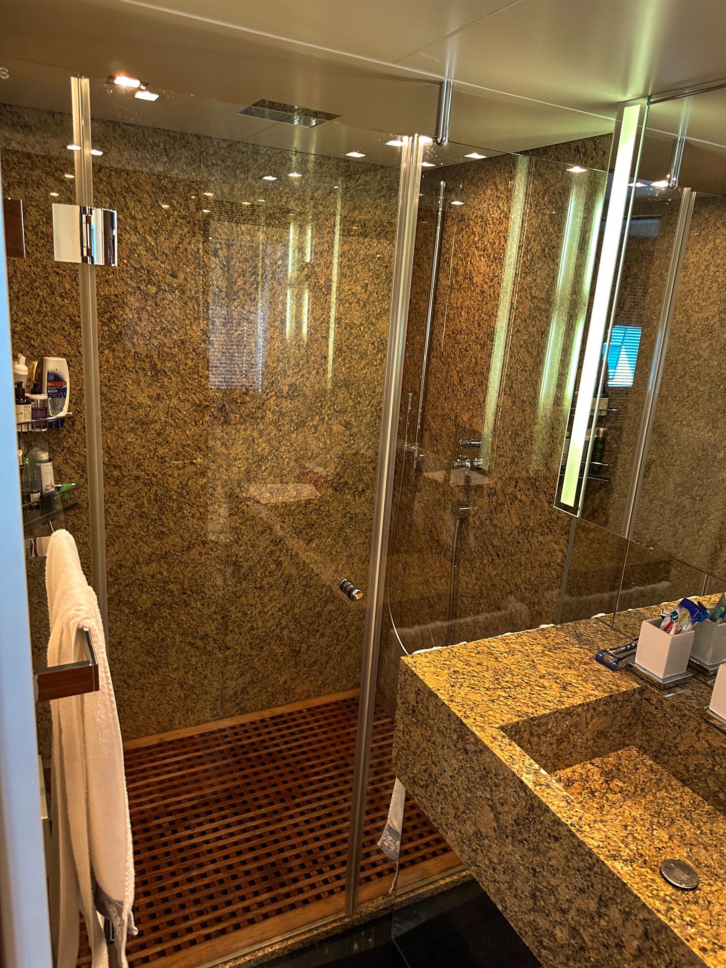 Luxurious bathroom on 2012 Avangard Yachts 42M, featuring elegant granite surfaces and modern fixtures.