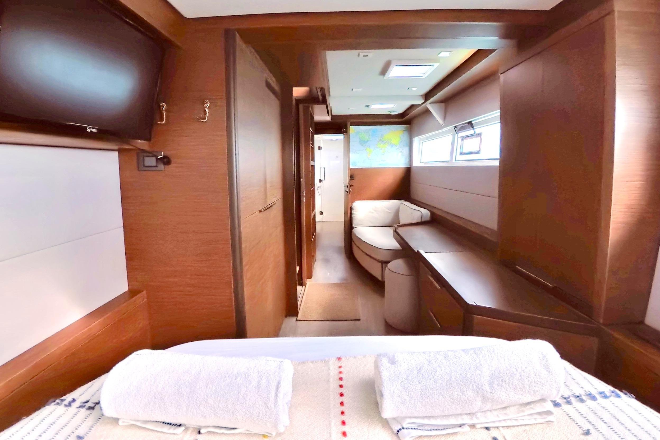 Luxurious interior of 2023 Lagoon 50 yacht with modern furnishings and natural light.