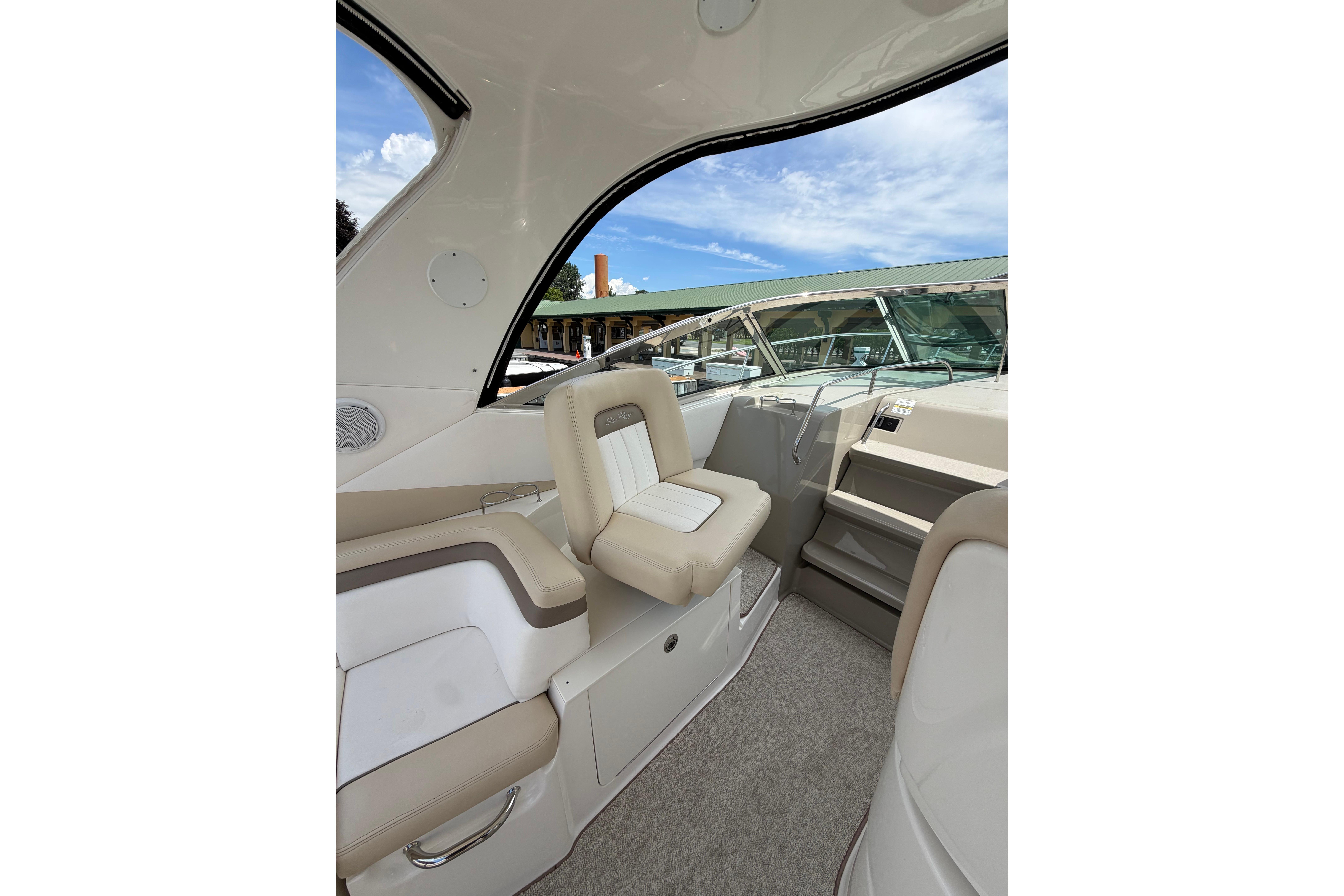 Interior view of 2012 Sea Ray Sundancer 370 yacht with beige seating and steps.