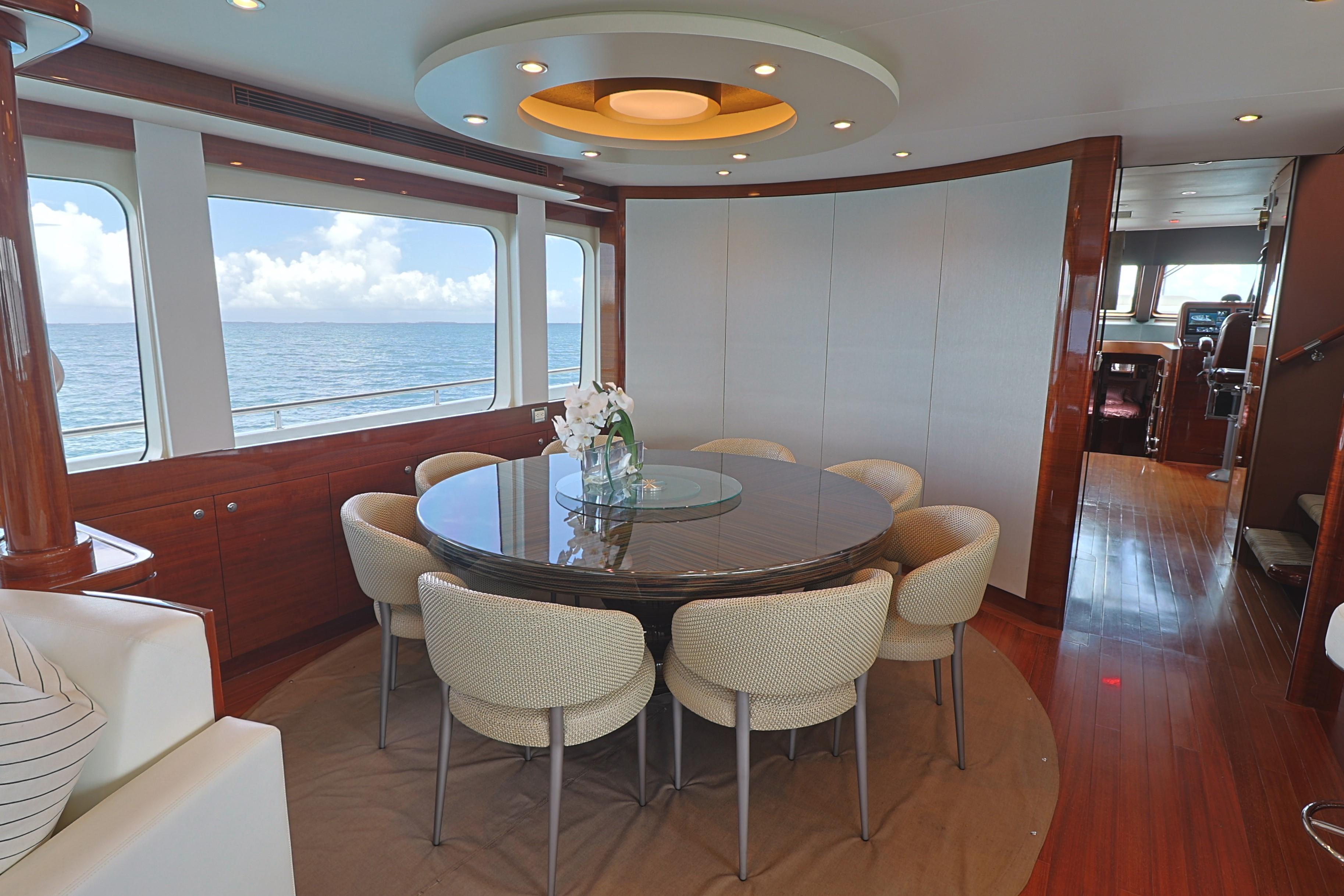 Luxurious dining area on 2013 Cheoy Lee Bravo yacht with ocean view.
