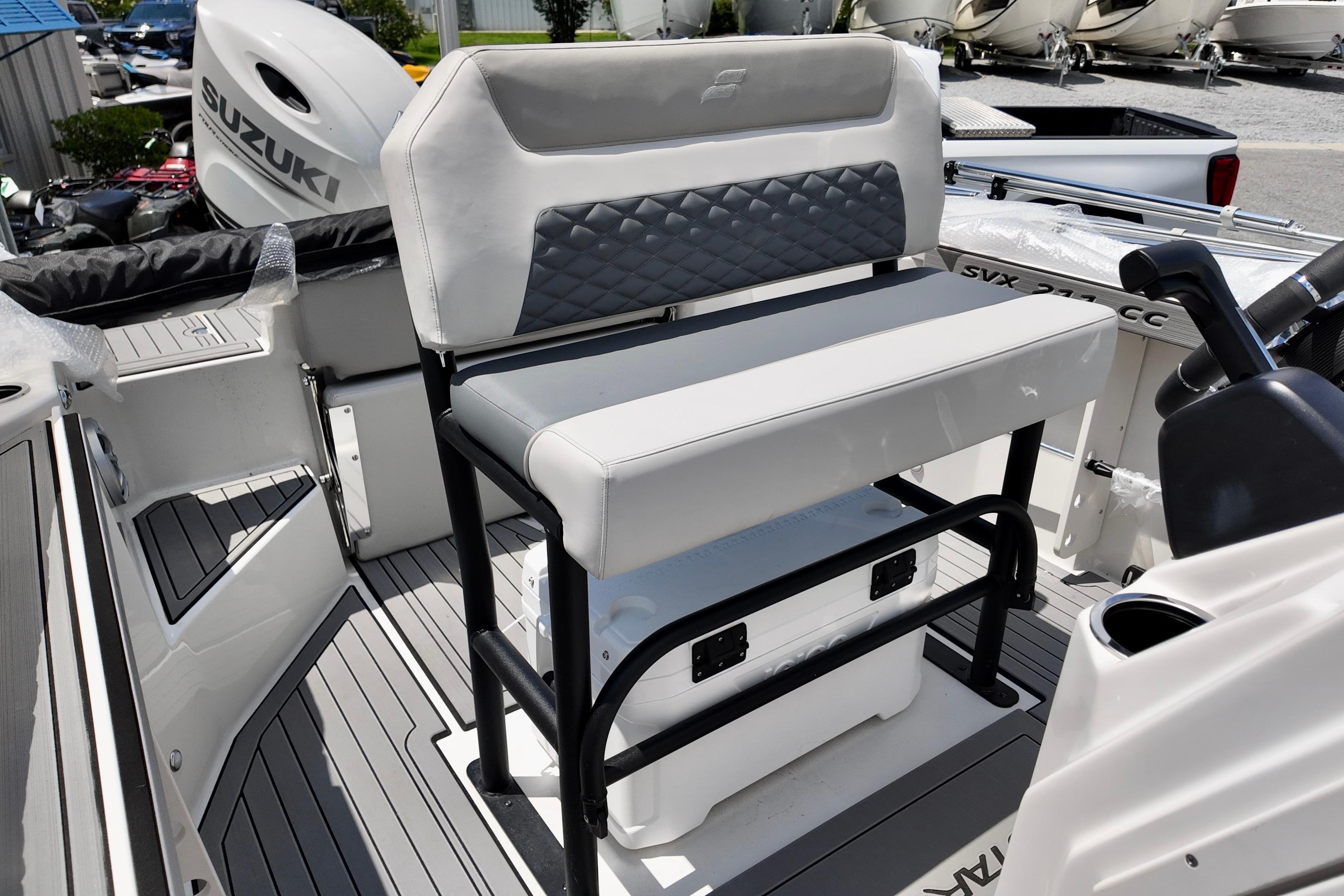2026 Starcraft SVX 211 OB CC boat interior with seating and Suzuki outboard motor.