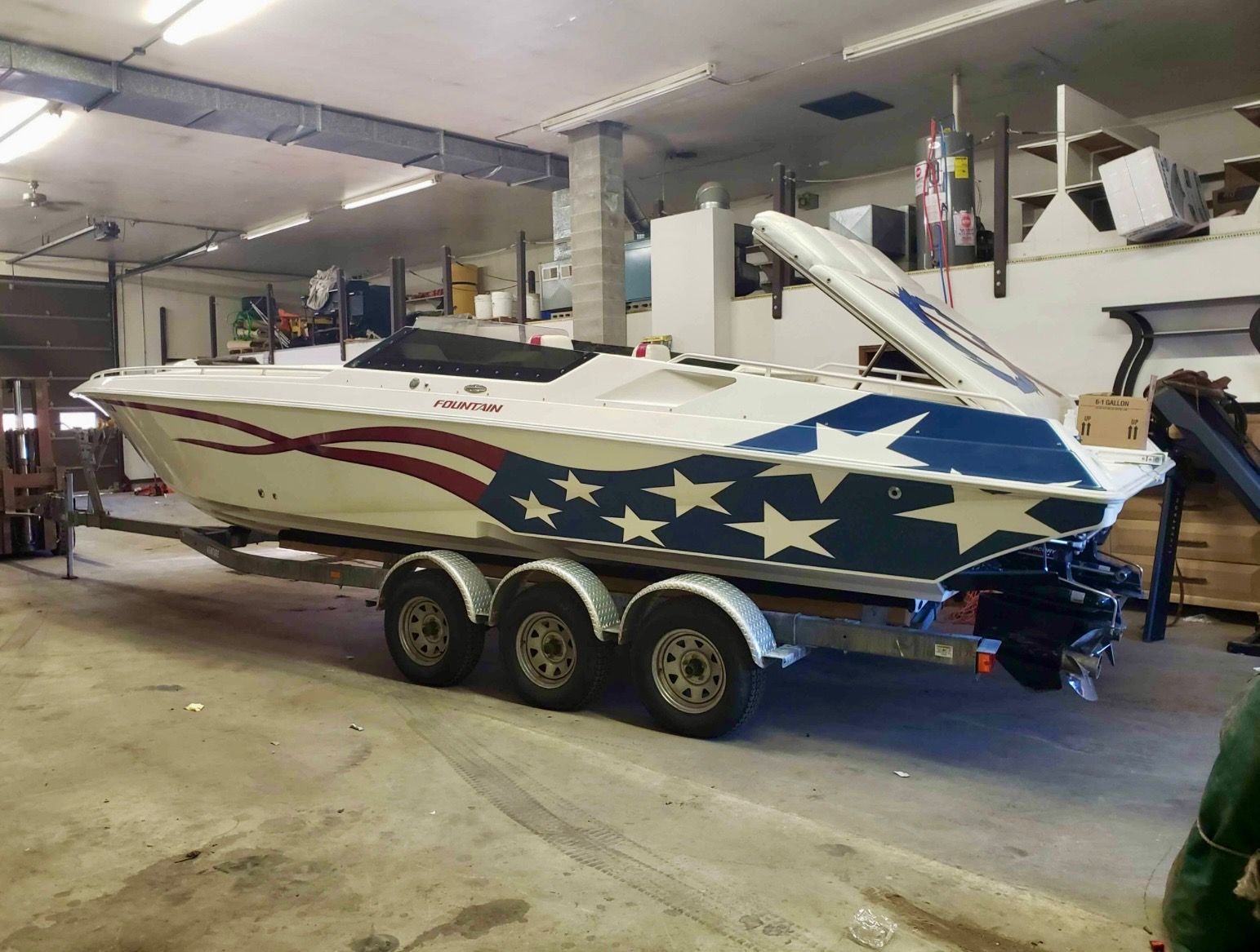 2000 Fountain Fever boat with star design in garage.