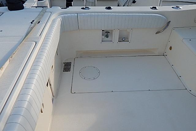 2003 World Cat 270 EC boat interior with white seating and deck features.