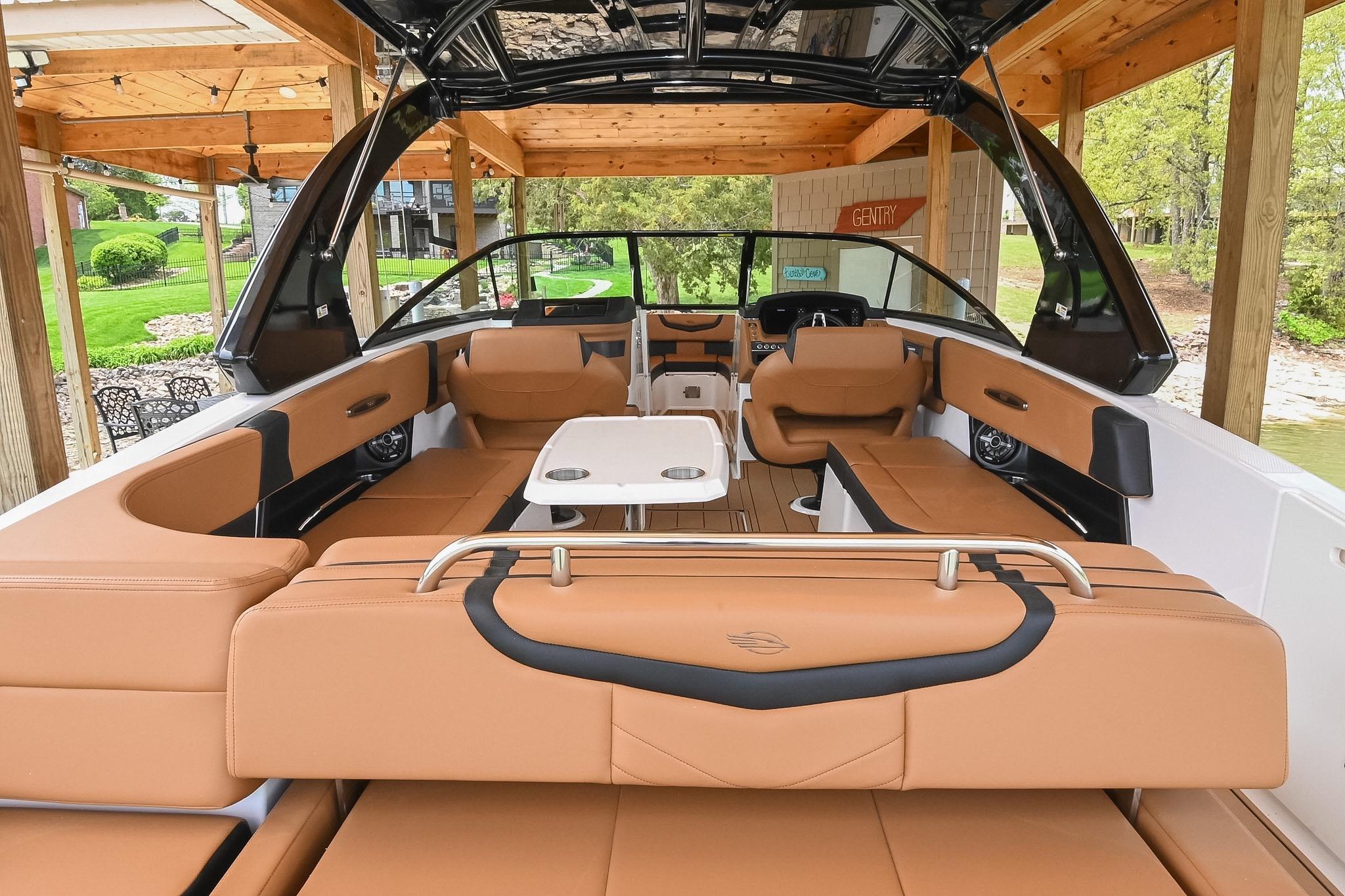2022 Chaparral 307 SSX boat interior with tan seating and modern design.