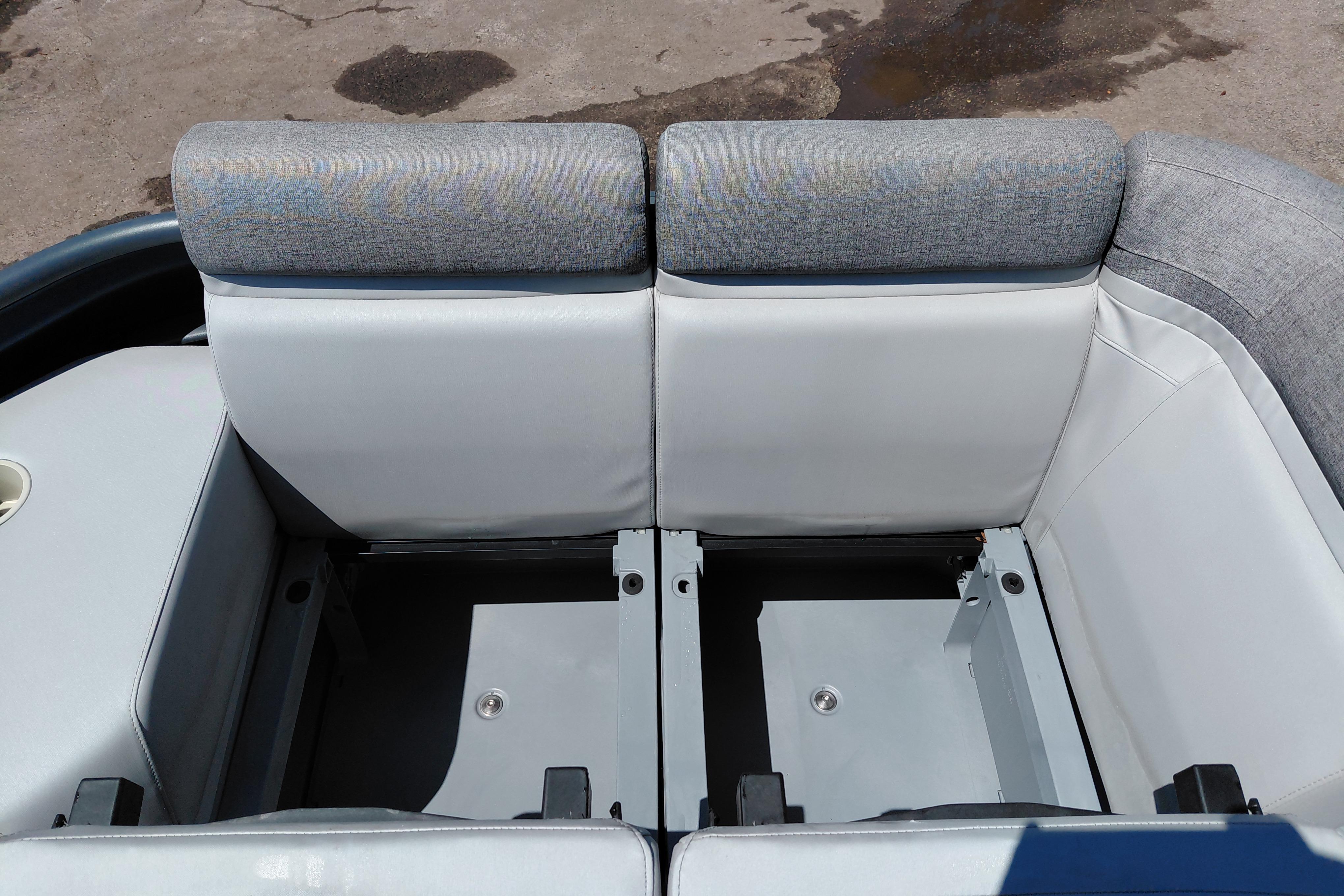 2024 Sea-Doo Switch Cruise 18 interior seating with storage compartments, featuring gray upholstery.
