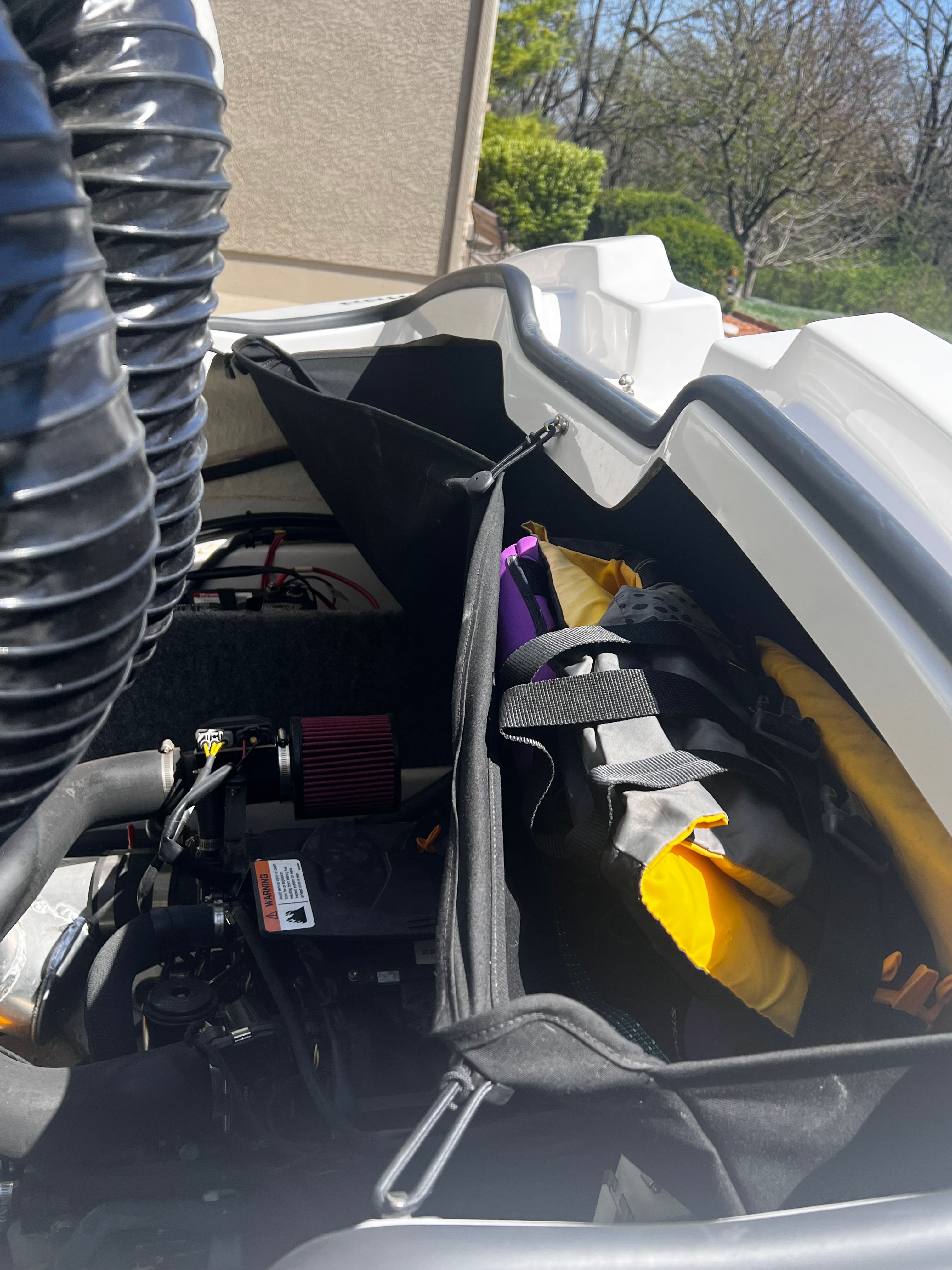 A view inside a Scarab 165 G boat with gear and engine visible.