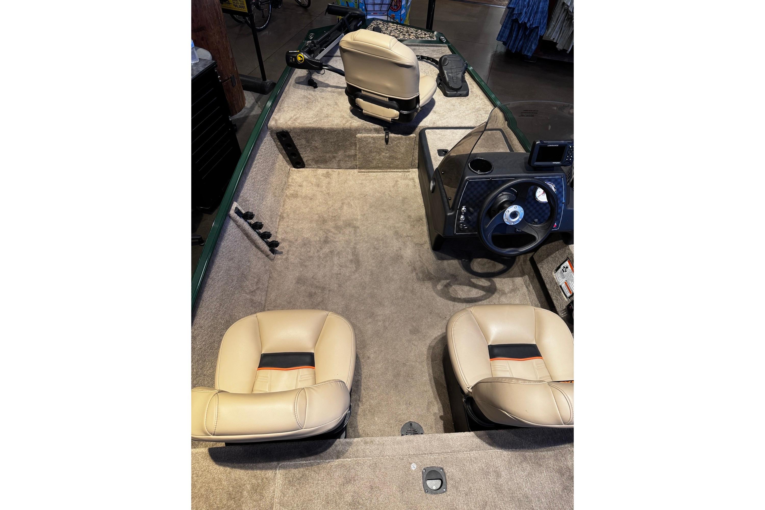 2026 Tracker Bass Tracker Classic Limited boat interior with beige seats and steering console.