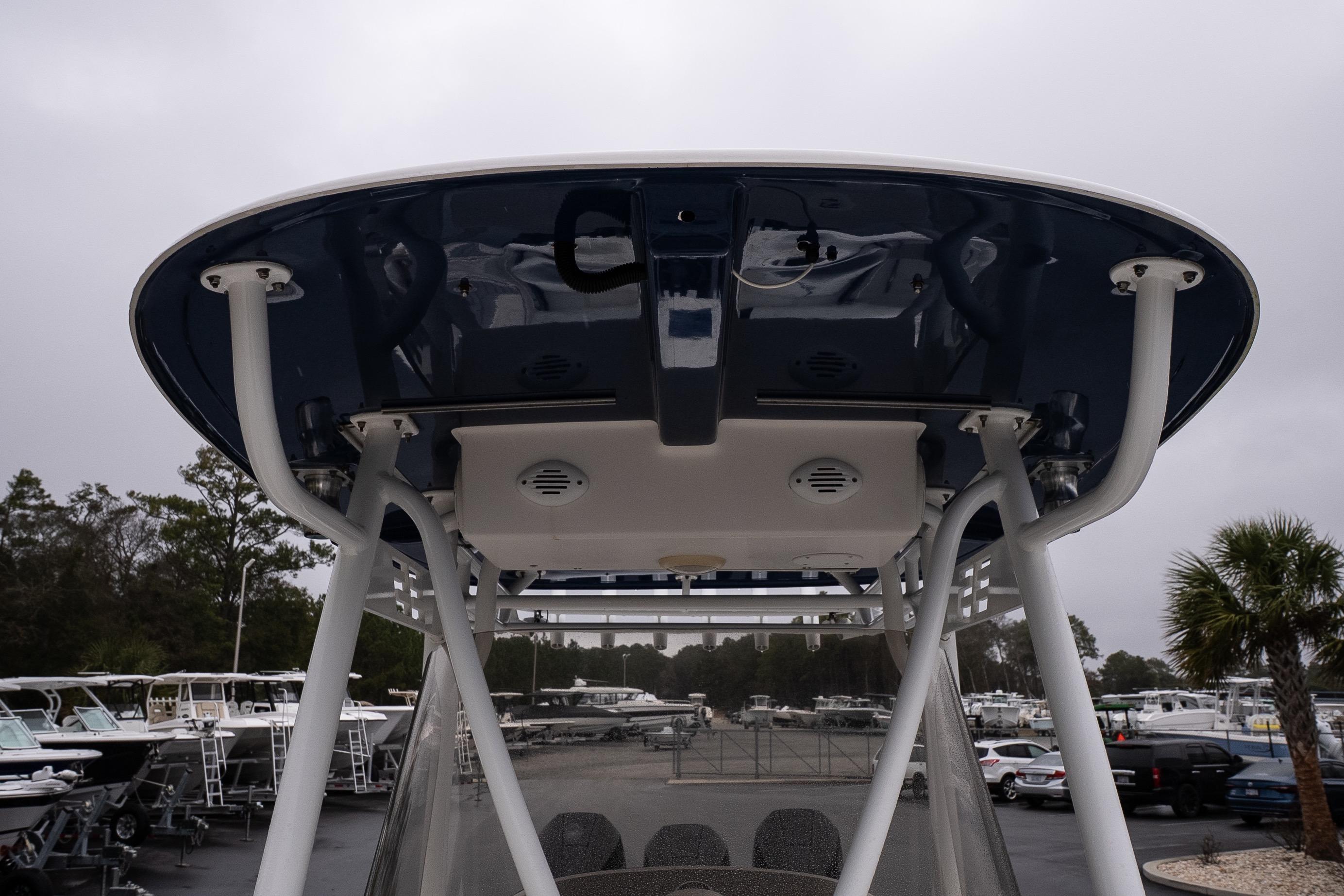 2007 Wellcraft 35 Tournament boat's T-top structure in a marina setting.