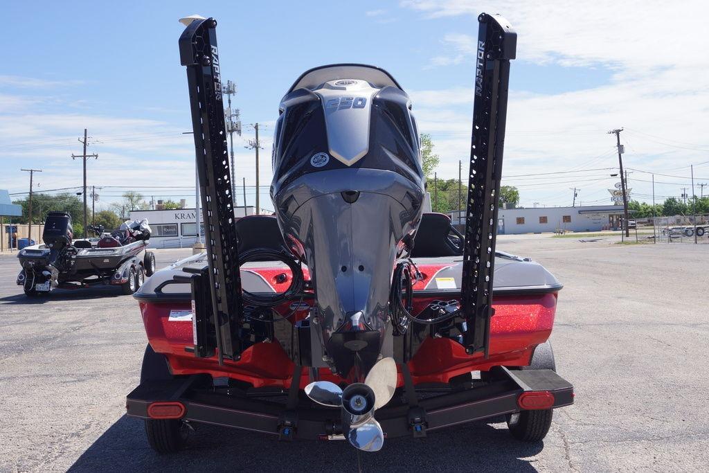2026 Skeeter ZXE21 boat with powerful outboard motor, parked on a trailer in a lot.