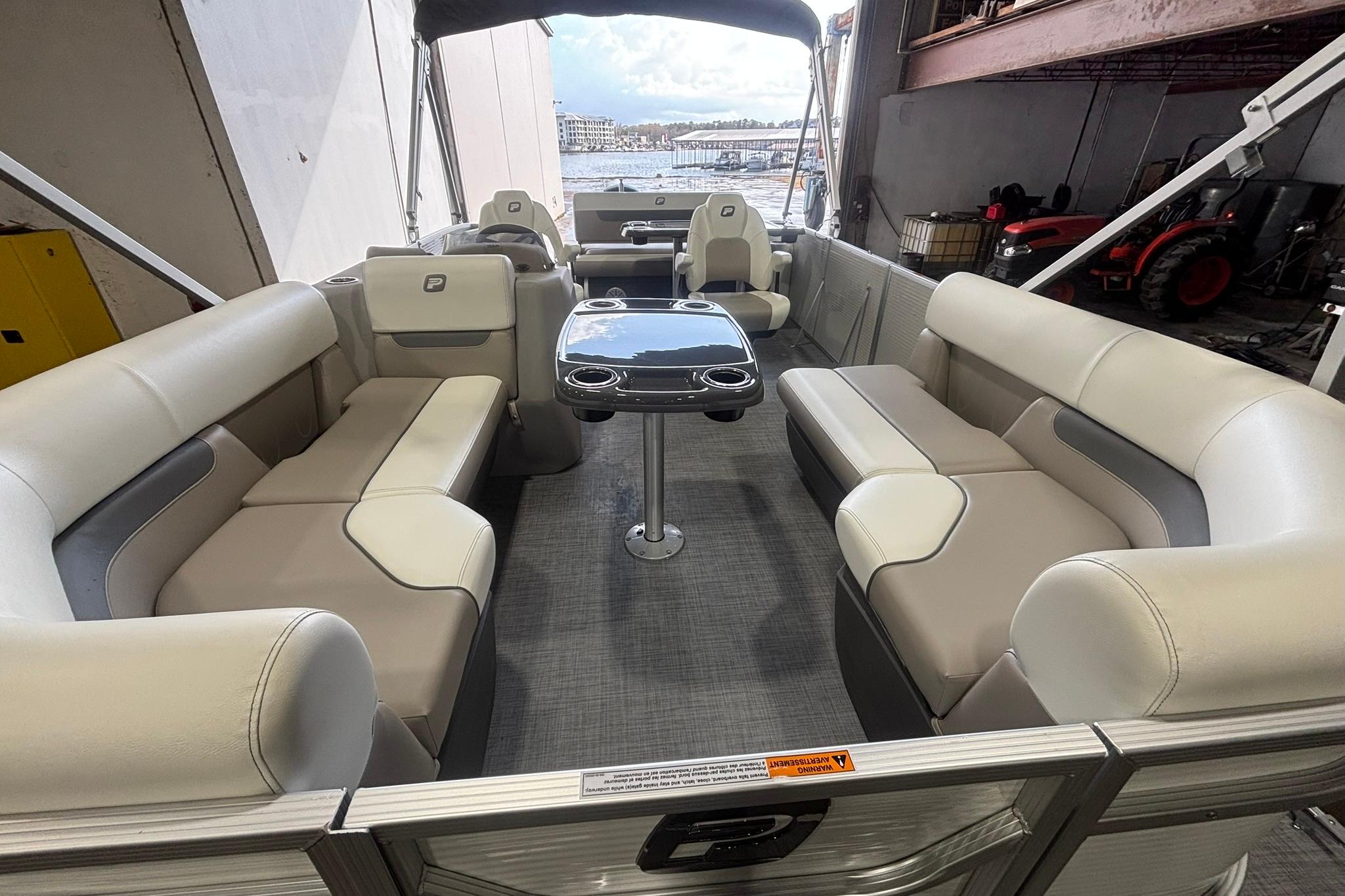 2025 Princecraft Vectra 21 RL pontoon boat interior with spacious seating and table.