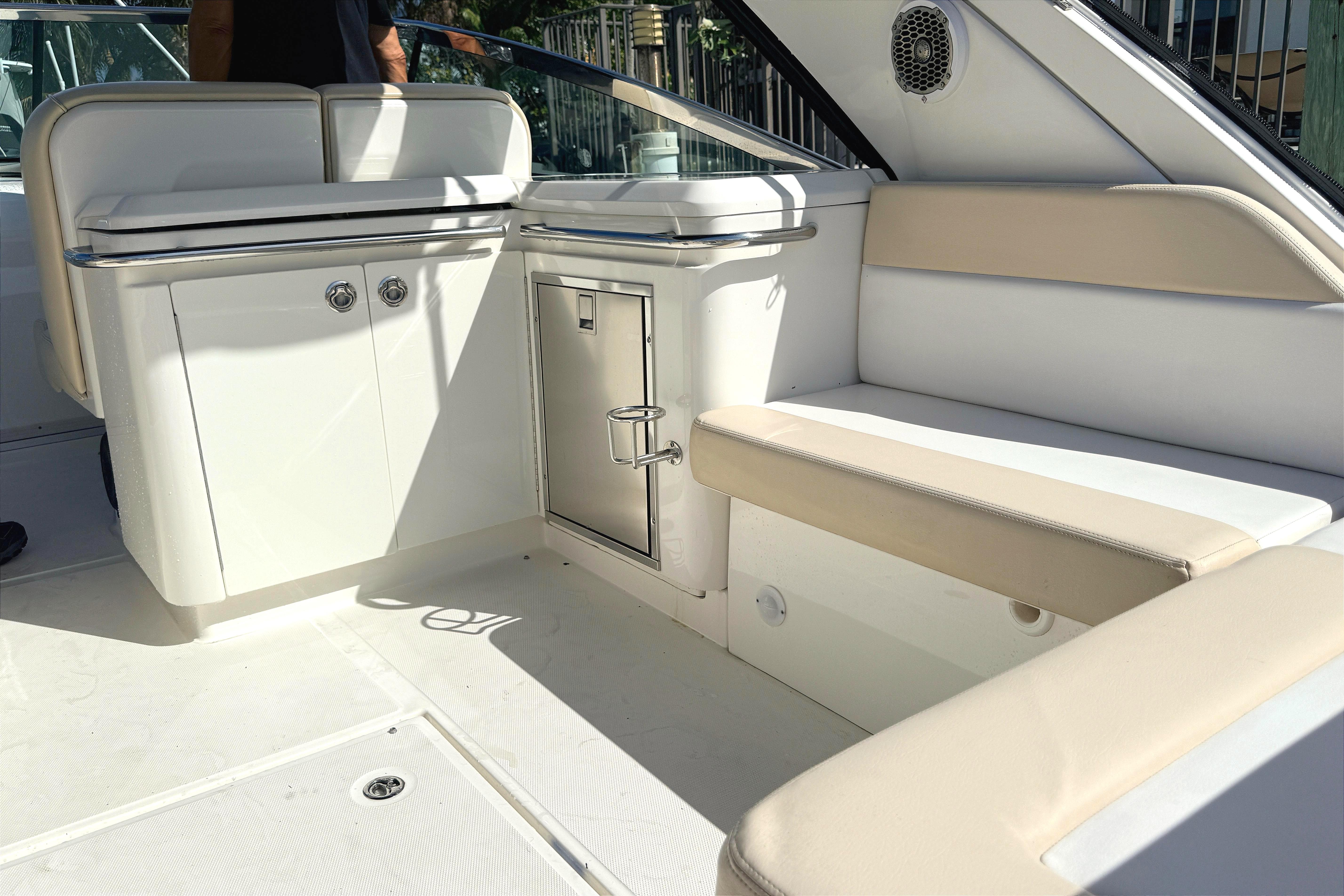 Interior of 2013 Sea Ray 370 Venture boat with seating and storage.