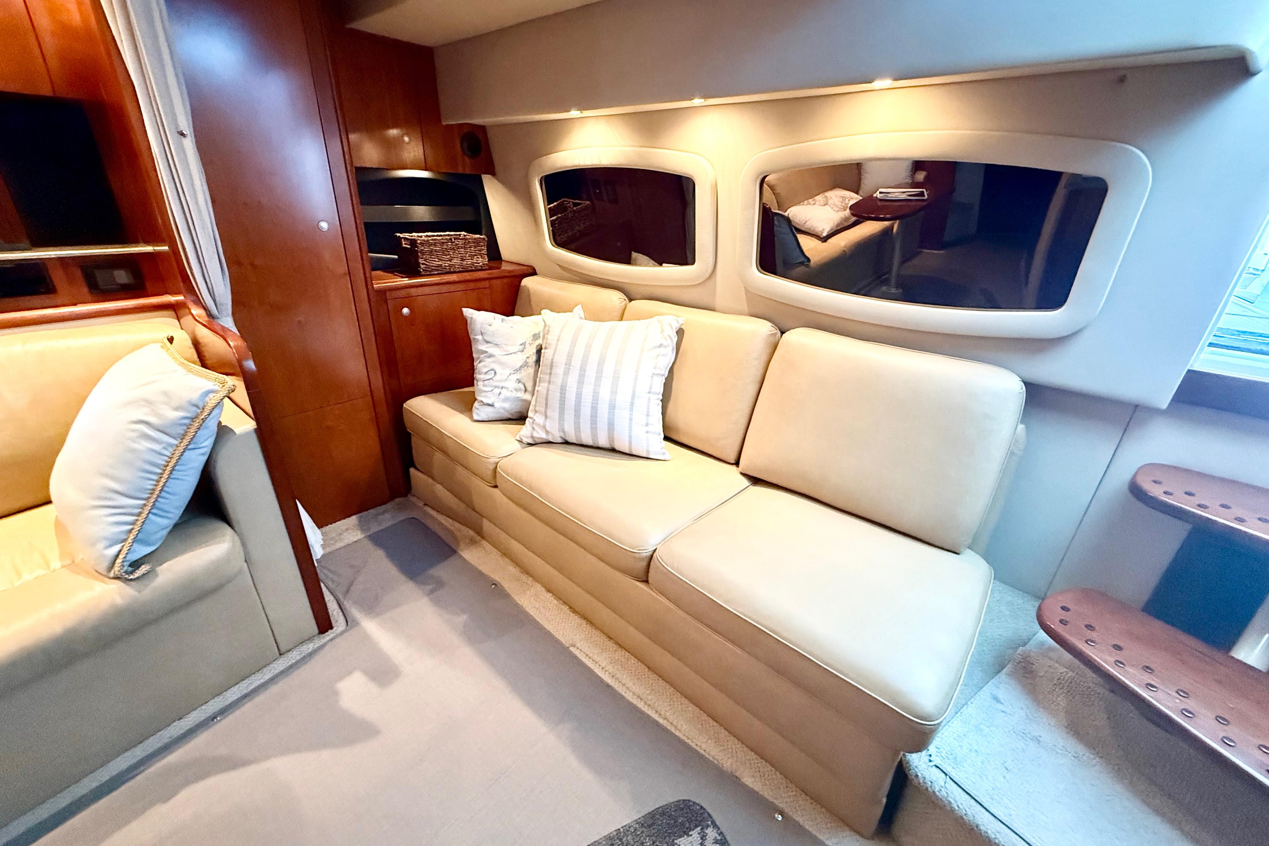 Luxurious interior of 2011 Cruisers Yachts 390 Sports Coupe with beige seating.