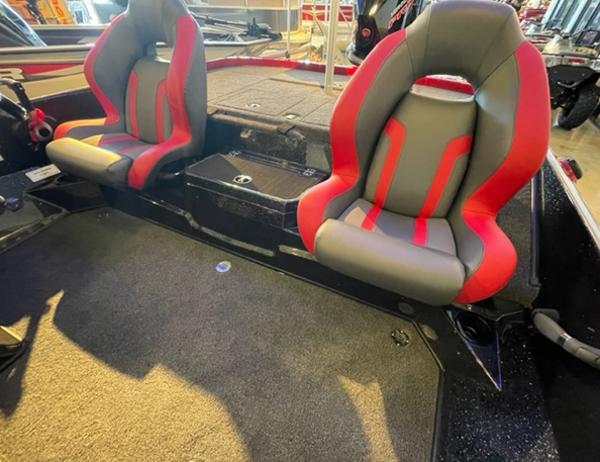 2025 Nitro Z19 boat interior with red and gray seats, carpeted flooring.