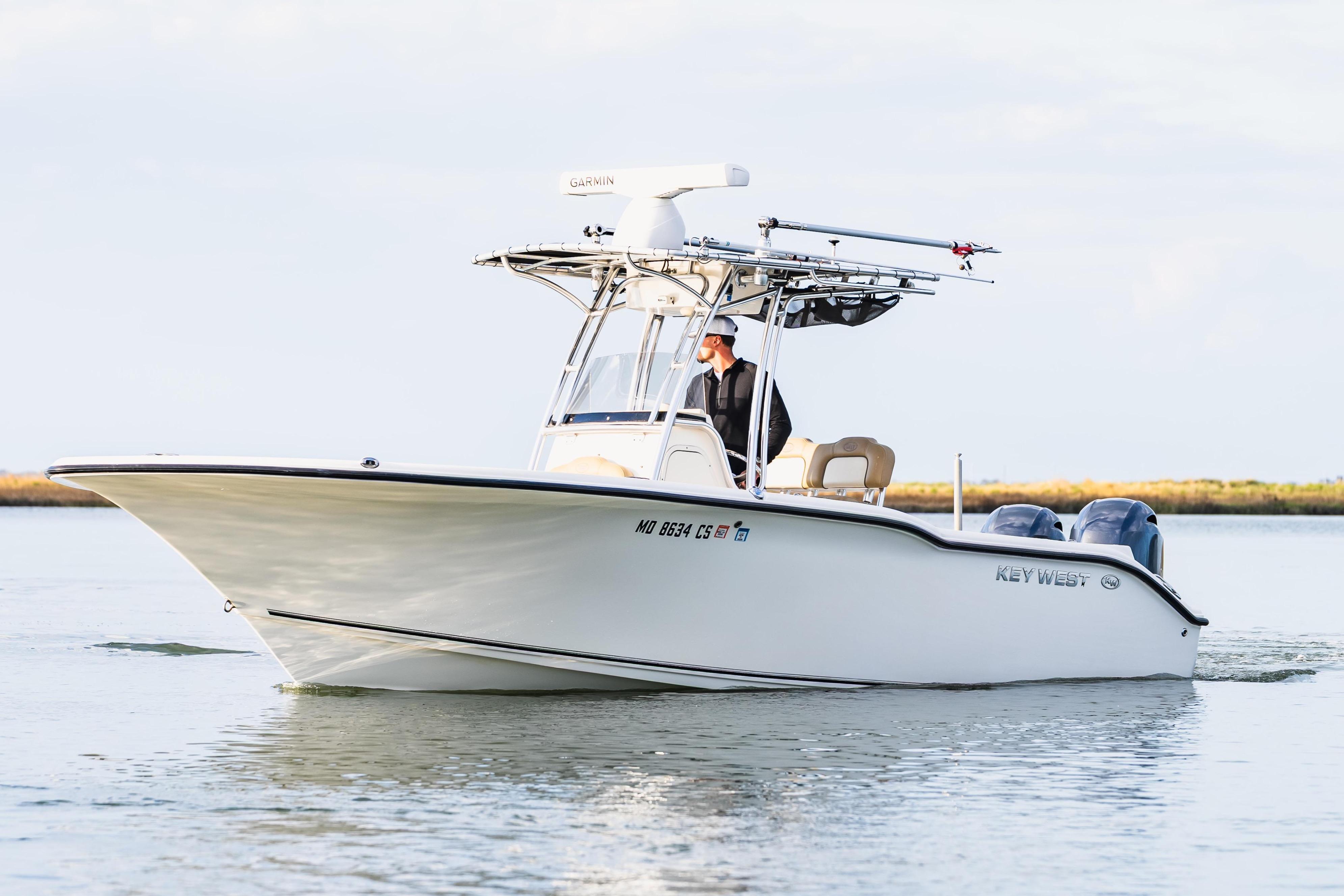 2018 Key West 244 Center Console boat on calm water.
