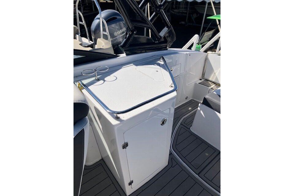 2024 Monterey M-65 boat interior with sleek white cabinetry and modern design.