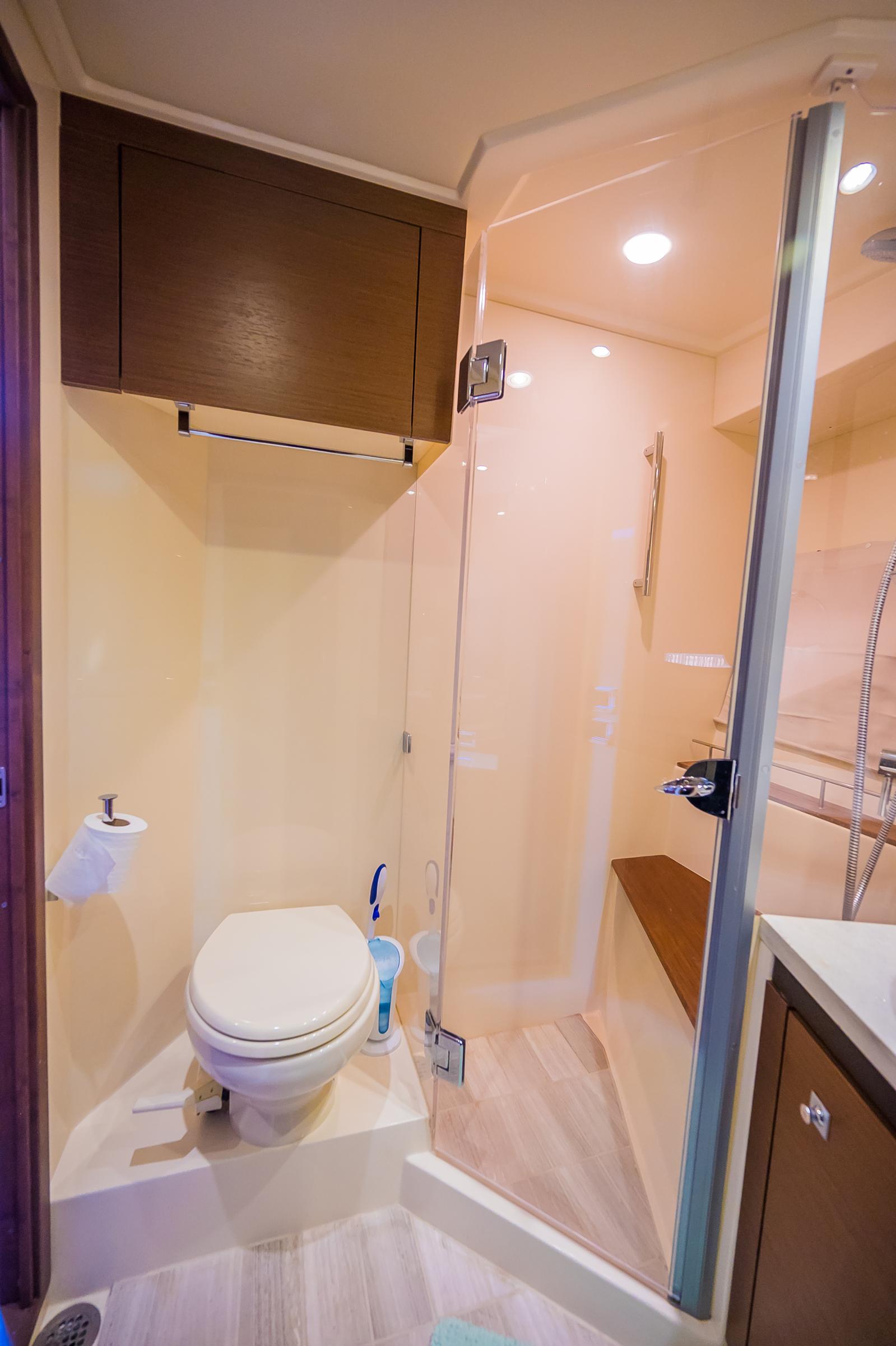 2015 Sea Ray Sundancer 510 yacht bathroom with modern fixtures and glass shower.