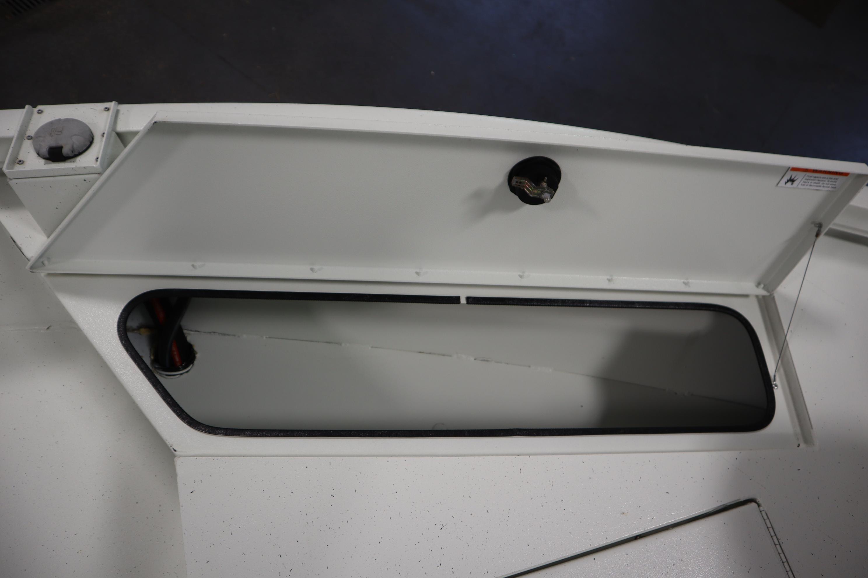 Open storage compartment on 2022 Crestliner 2200 CC boat.