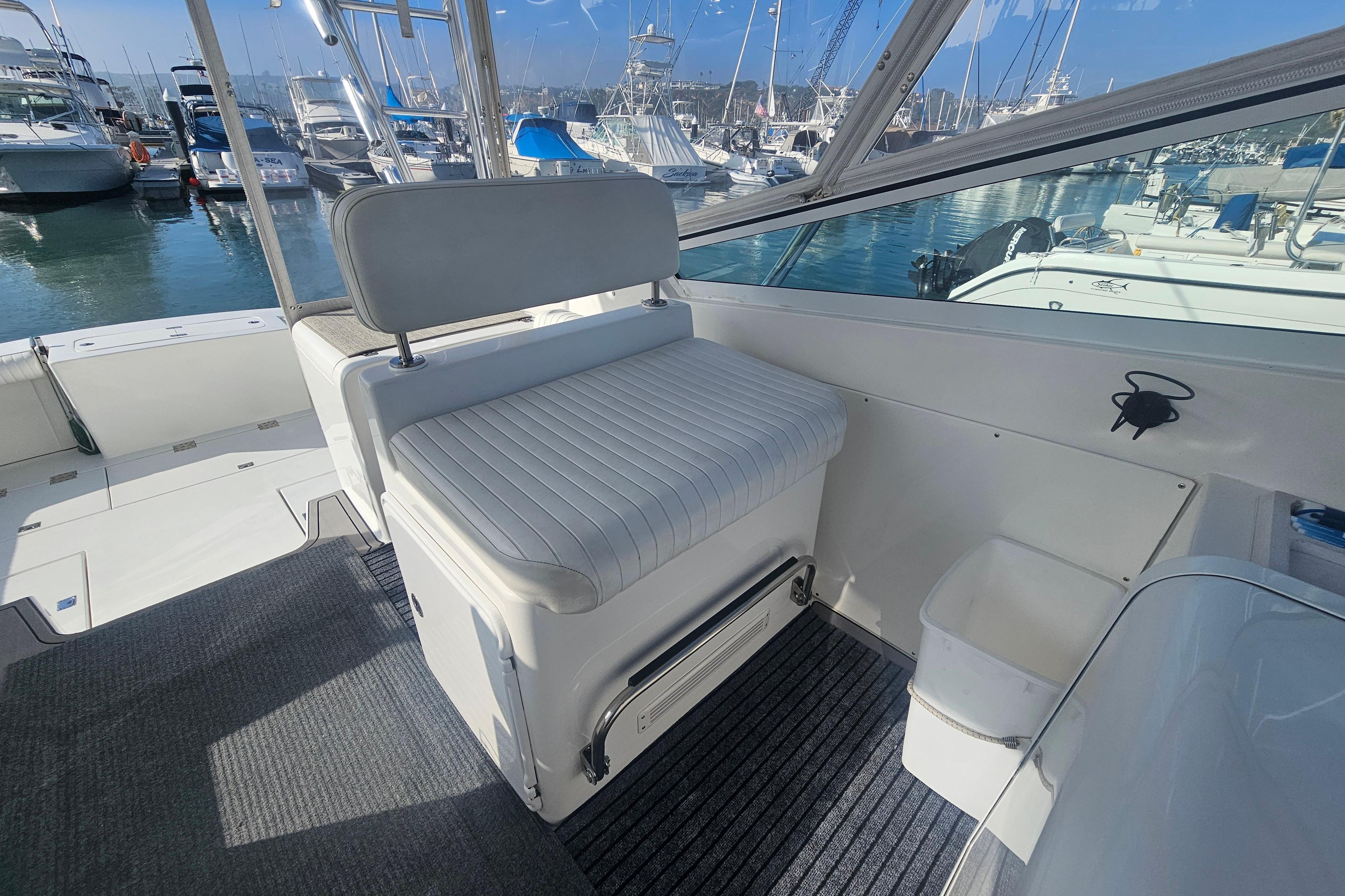 2003 Topaz 32 Express boat interior with seating and marina view.