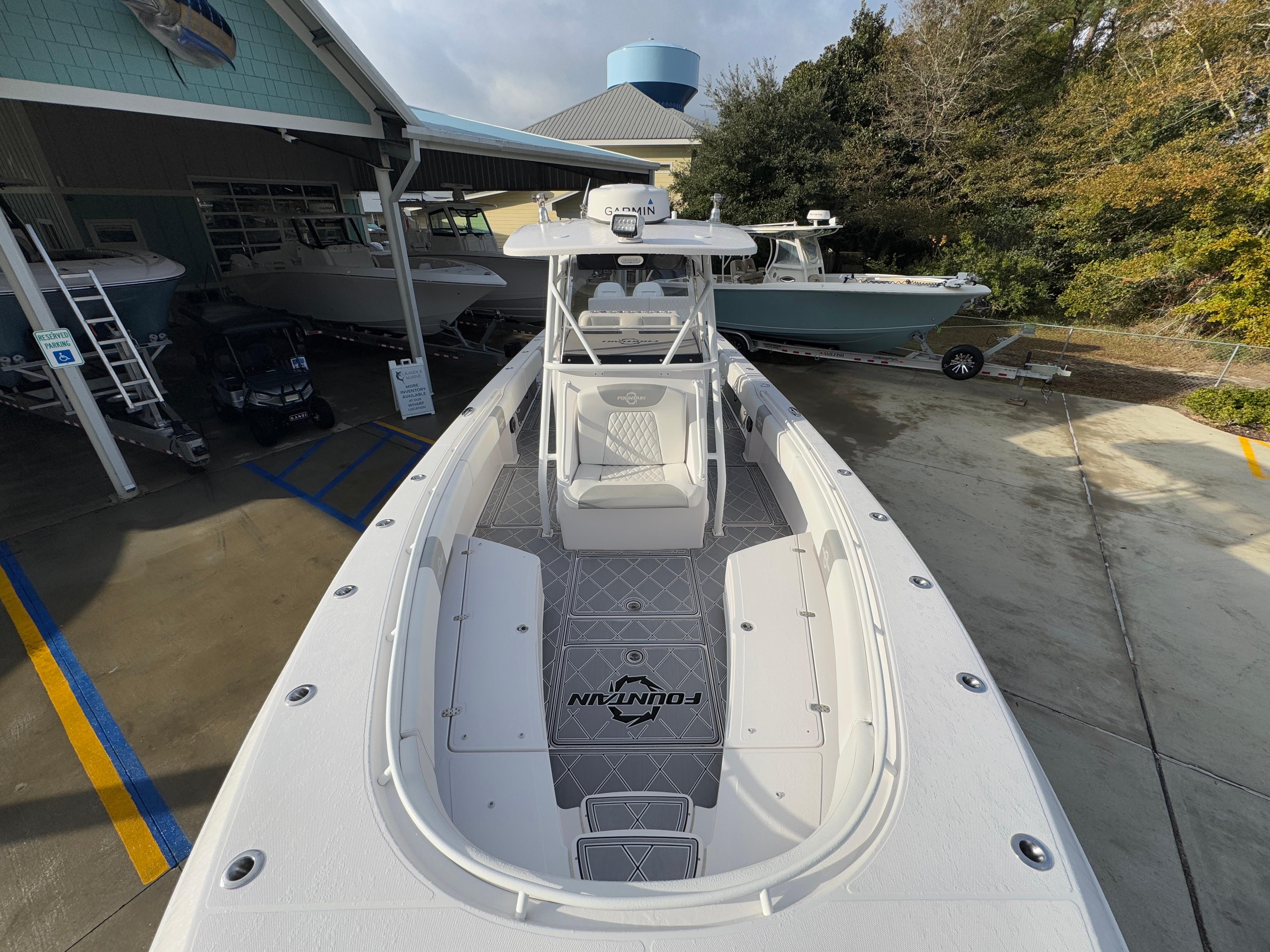 2018 Fountain 34 CC boat docked at marina, top view.