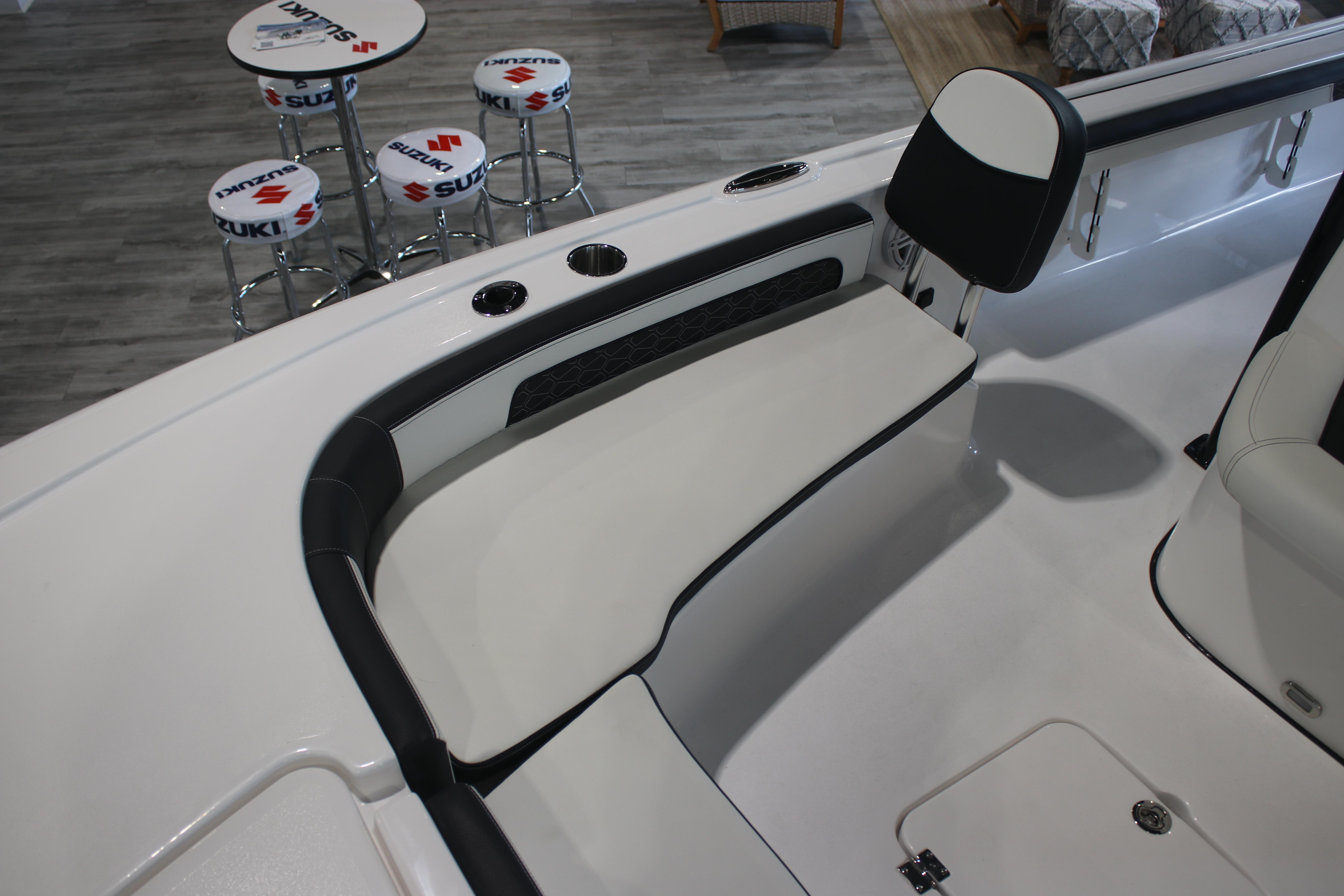 2026 Tidewater 2300 Carolina Bay boat interior with seating and Suzuki-branded stools.