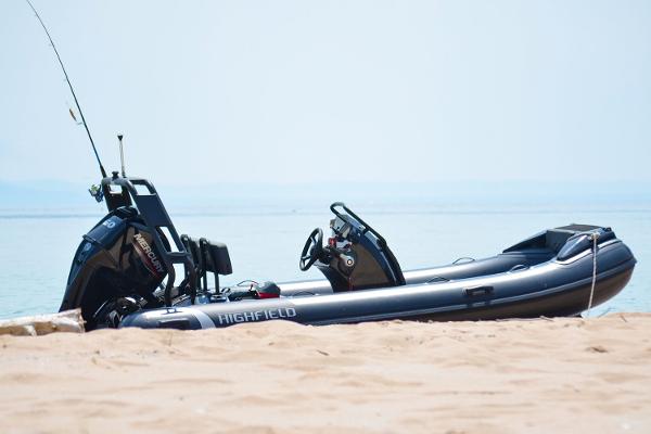Manufacturer Provided Image: 2025 Highfield Sport 420 boat on sandy beach with calm sea background.