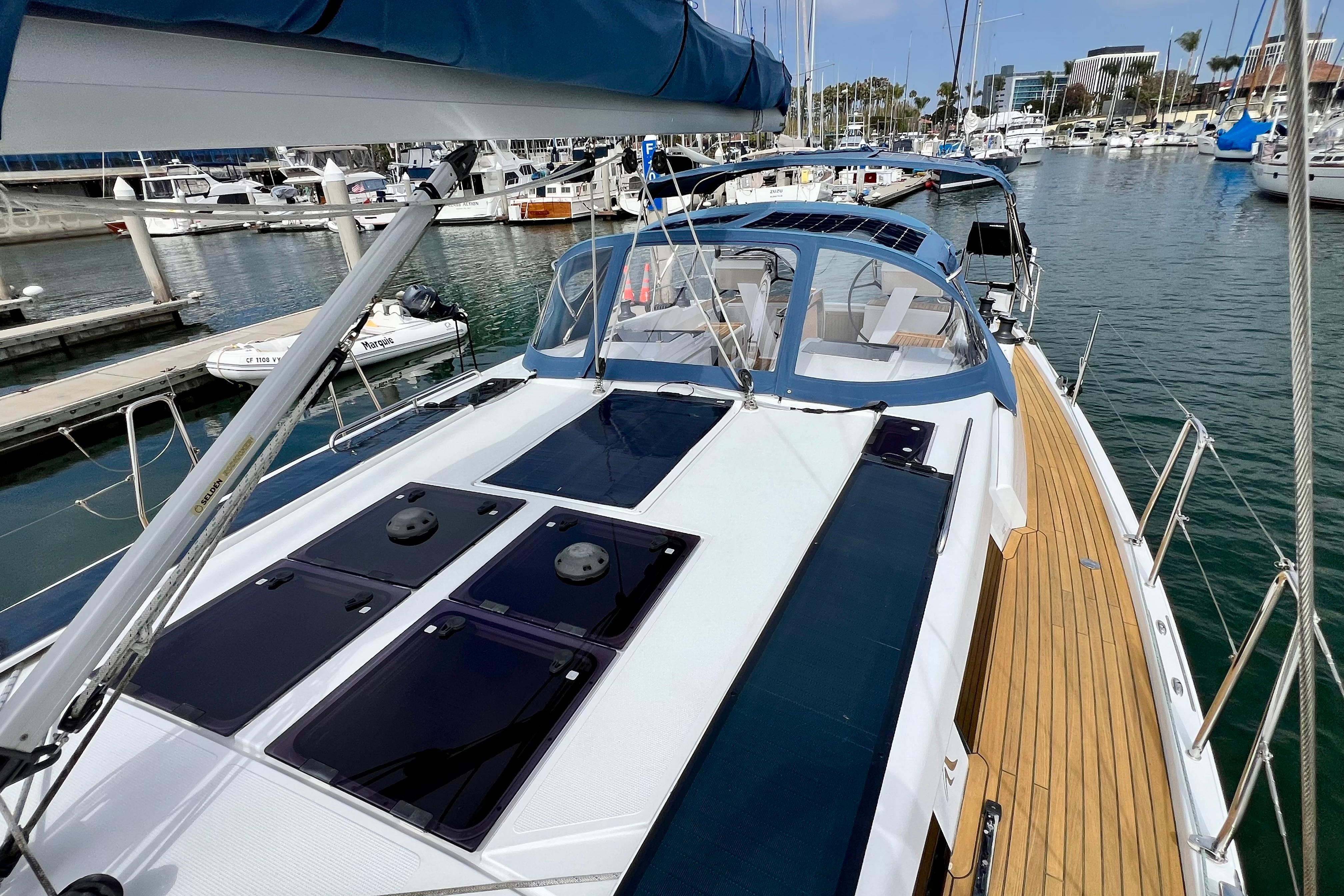 2016 Hanse 455 yacht docked in marina, showcasing sleek design and spacious deck.
