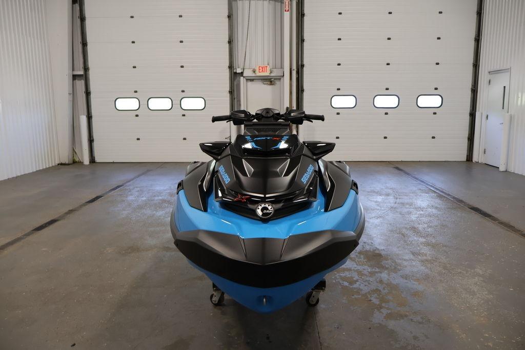 2026 Sea-Doo RXT-X 325 jet ski in a garage, front view.