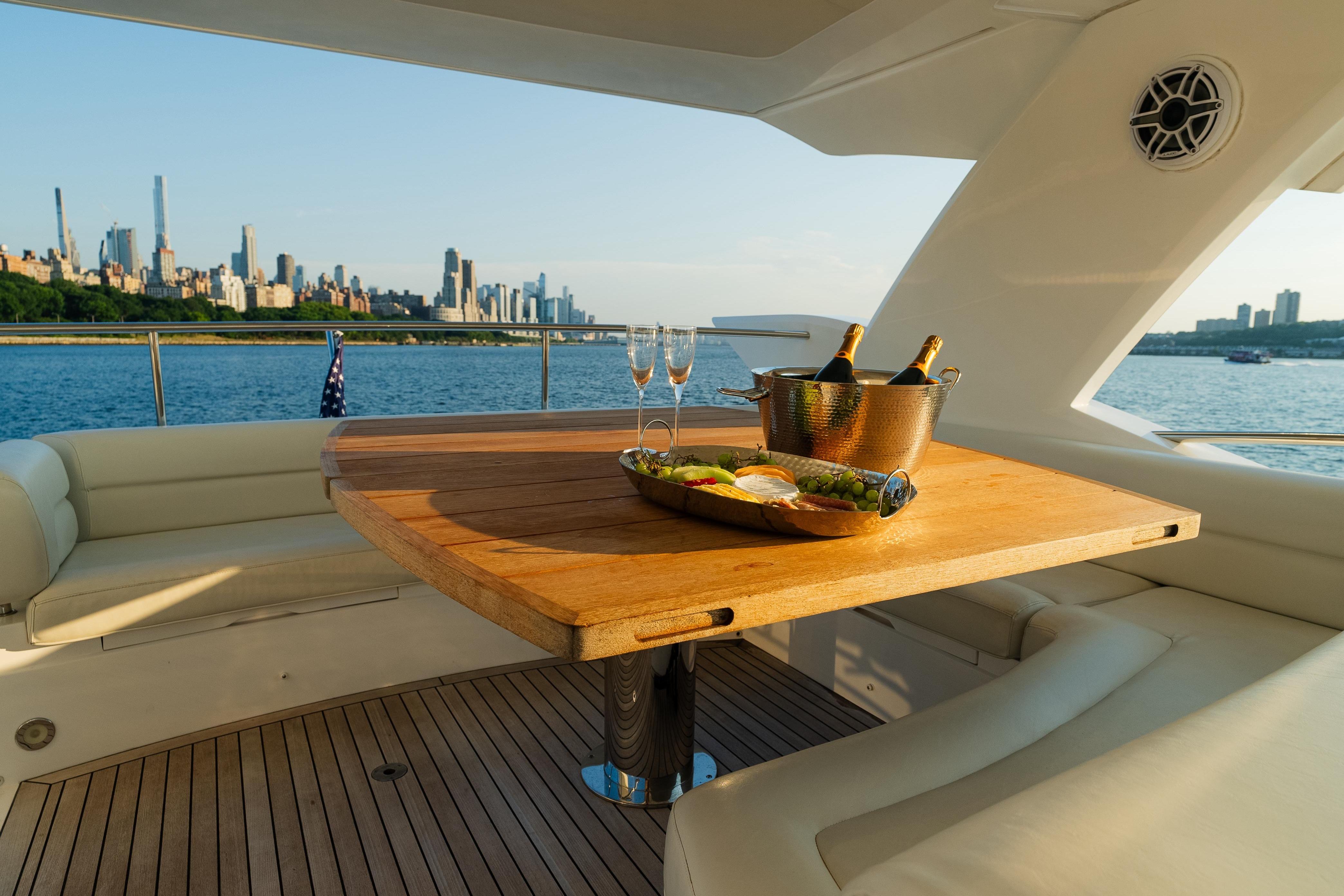 Luxurious Sunseeker Manhattan 65 yacht deck with city skyline view, 2016 model.