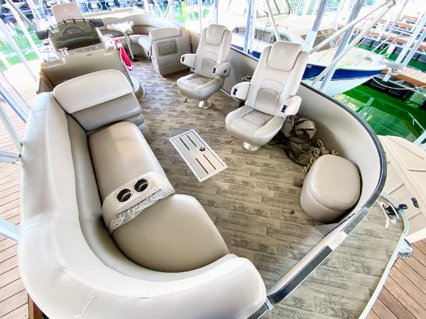 The image shows the interior of a 2011 Premier 275 Grand Majestic PTX with beige seating.