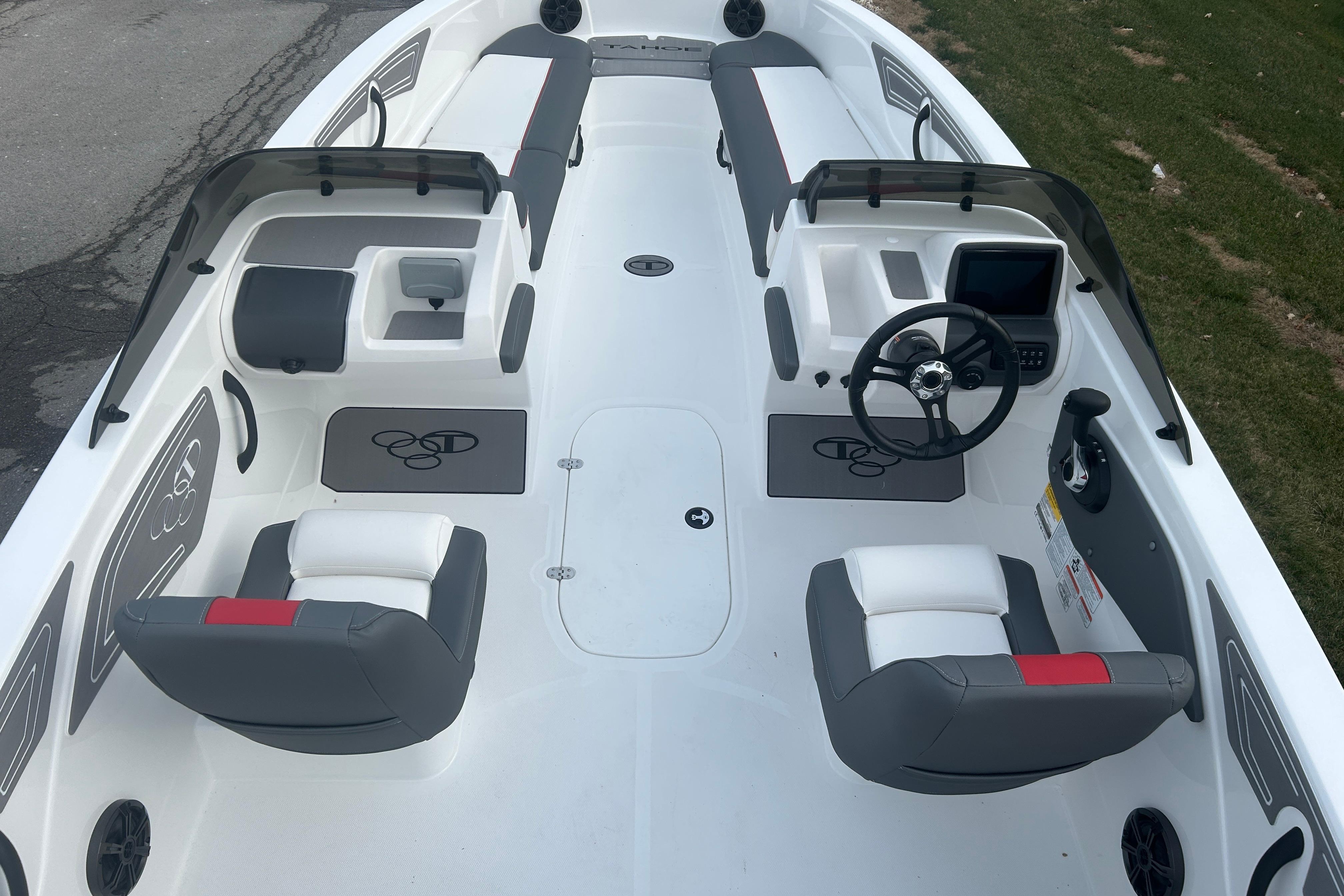 2025 Tahoe T21 boat interior with dual seating, steering console, and modern design.