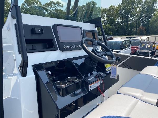 2021 Scarab 255 Open ID boat dashboard with steering wheel and control panel.