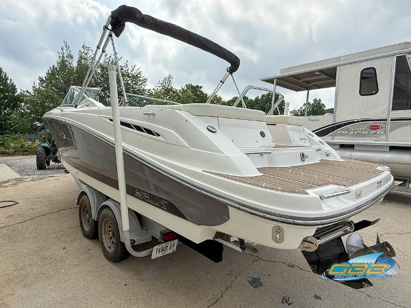 2008 Sea Ray 270 SLX boat on trailer, rear view, parked outdoors.