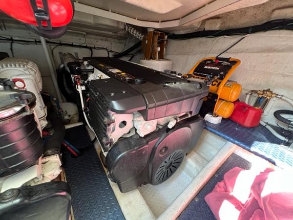 Engine room of a 2009 Ovation 52 yacht with visible machinery and equipment.