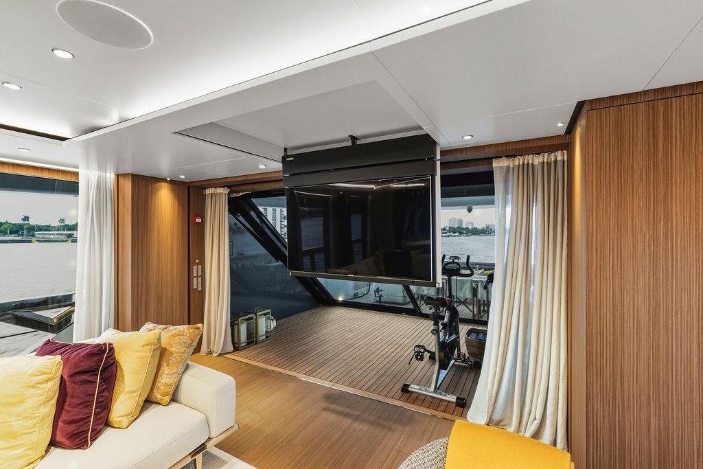 Luxurious 2018 Custom Line 120 yacht interior with modern decor and waterfront view.