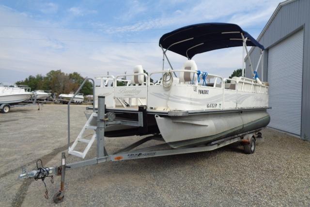 2008 Bentley Pontoons 200 CRUISE on trailer, parked outdoors near a storage facility.