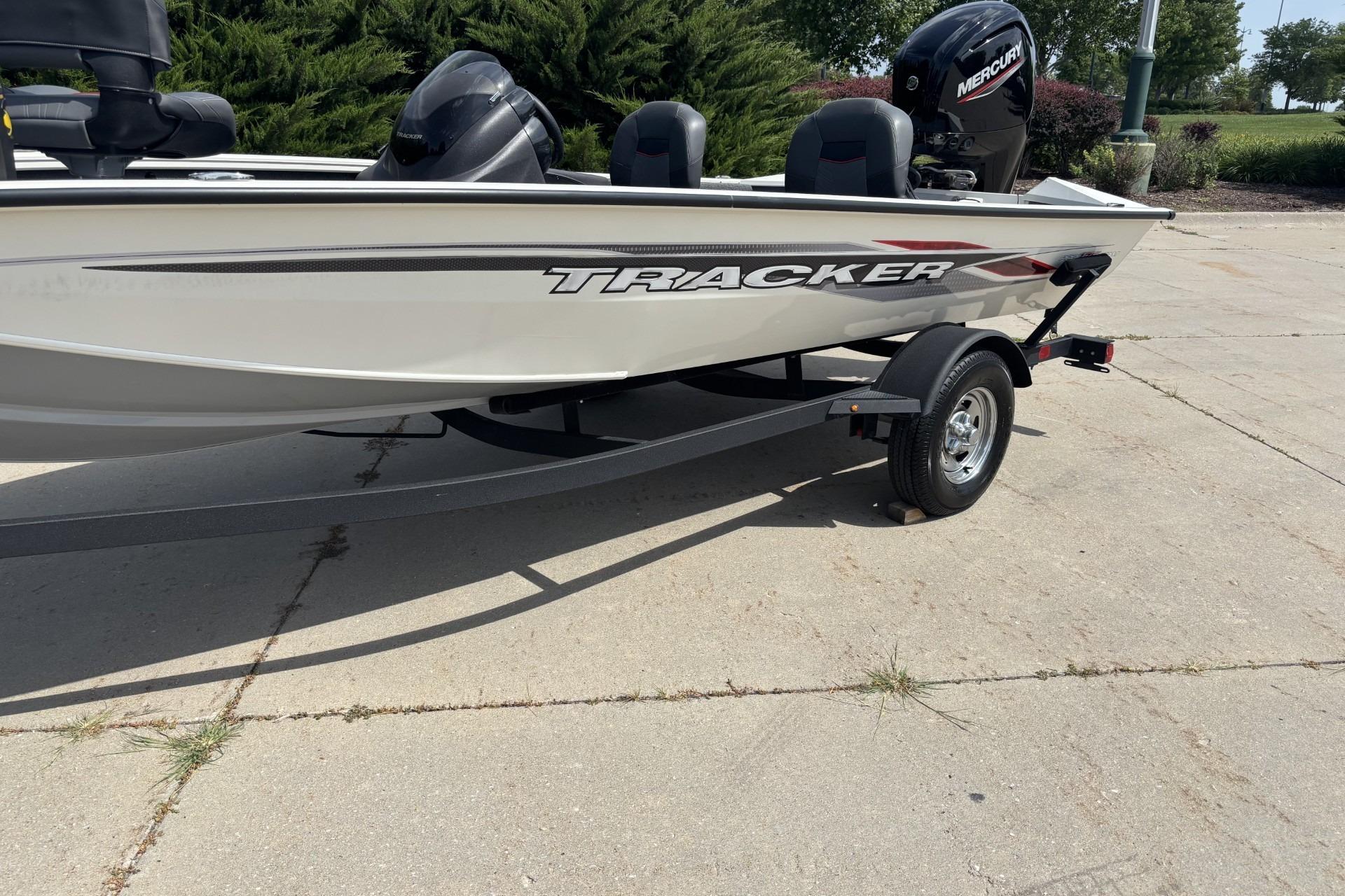 2024 Tracker Pro Team 175 TF boat on trailer, featuring sleek design and Mercury engine.
