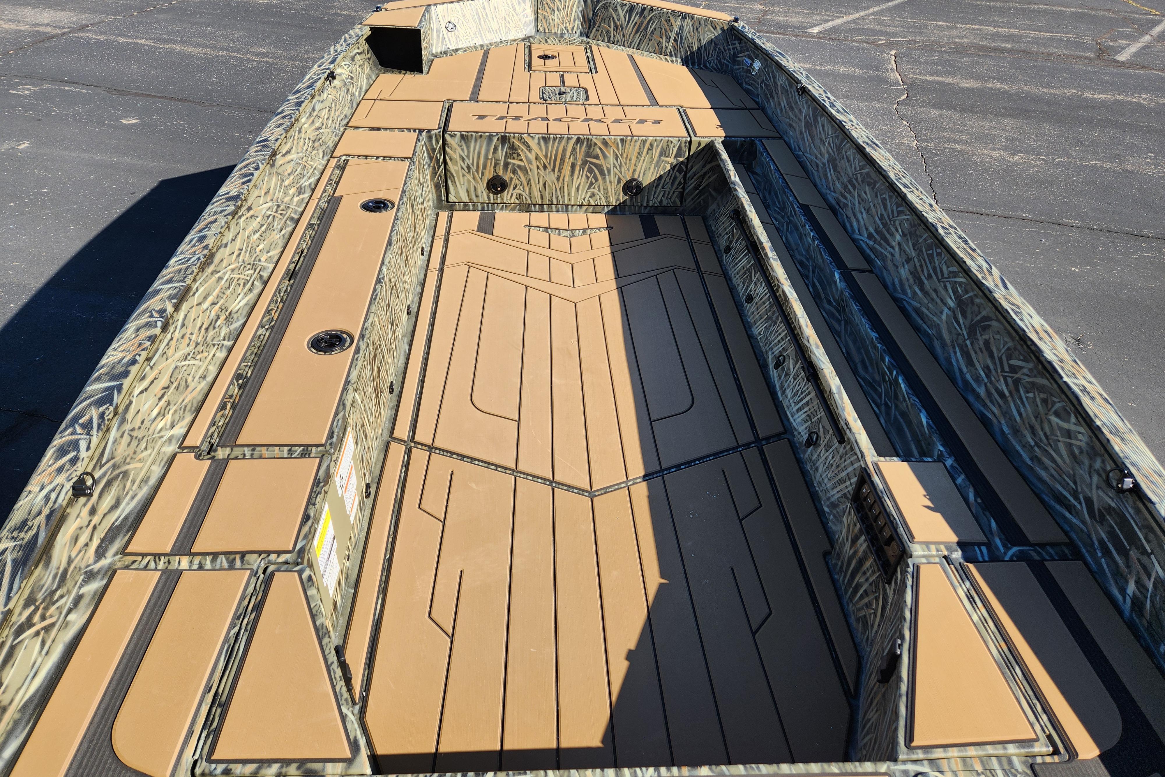 2026 Tracker Grizzly 1756 T Marsh boat interior with camouflage design and spacious deck.