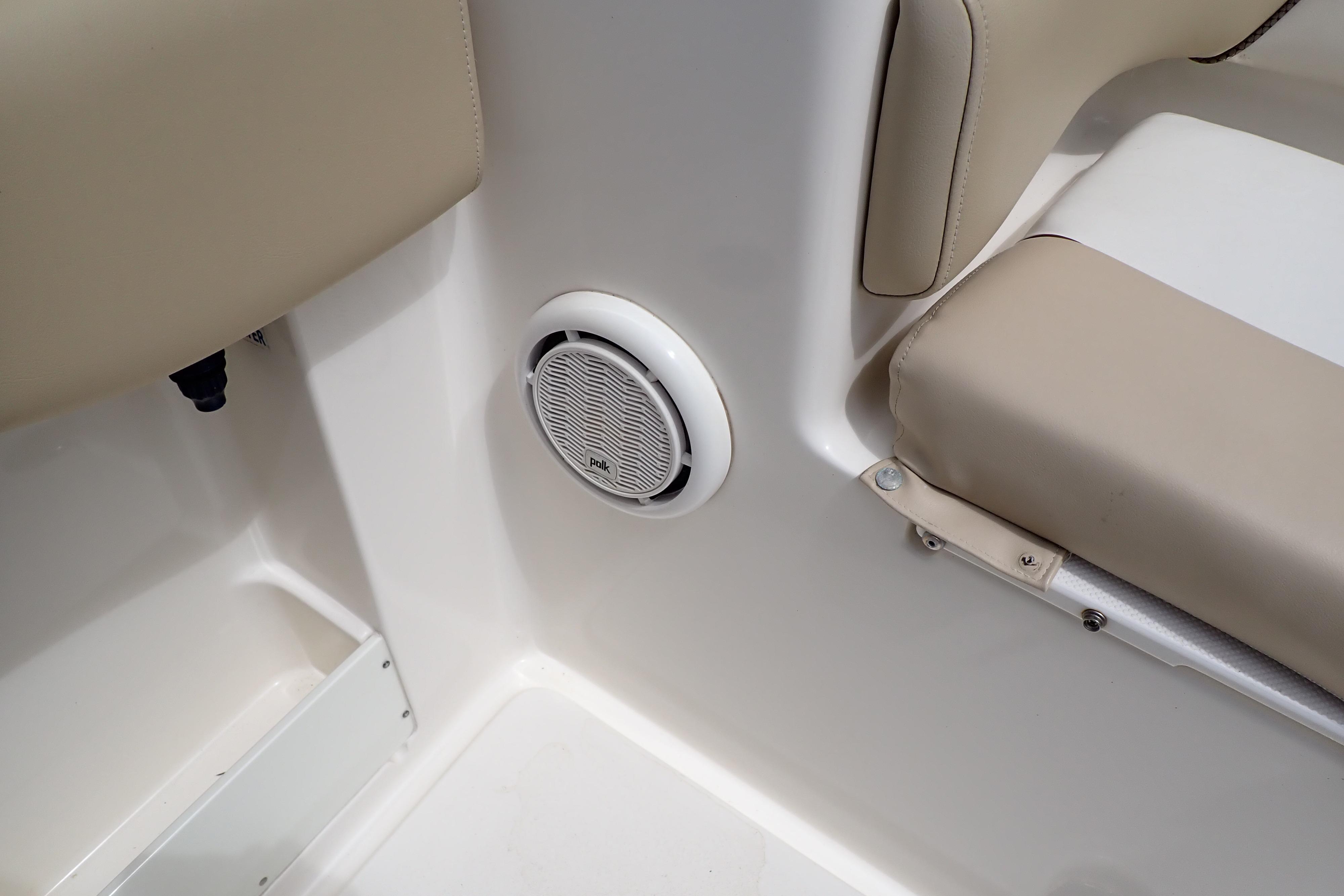 2019 Key West 263 FS boat interior with beige seating and Polk audio speaker.