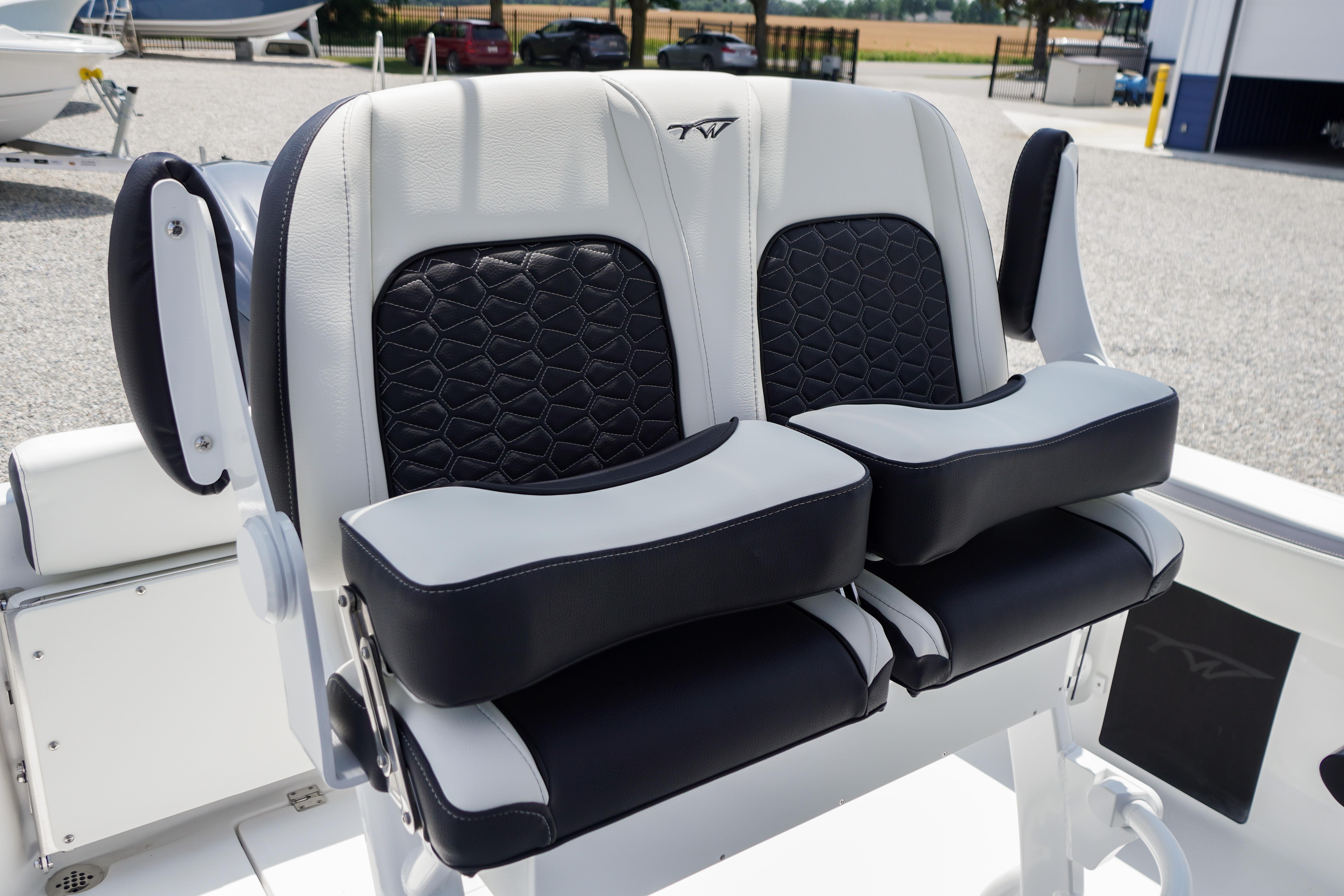 2027 Tidewater 220 CC Adventure boat seats with black and white cushioned design.