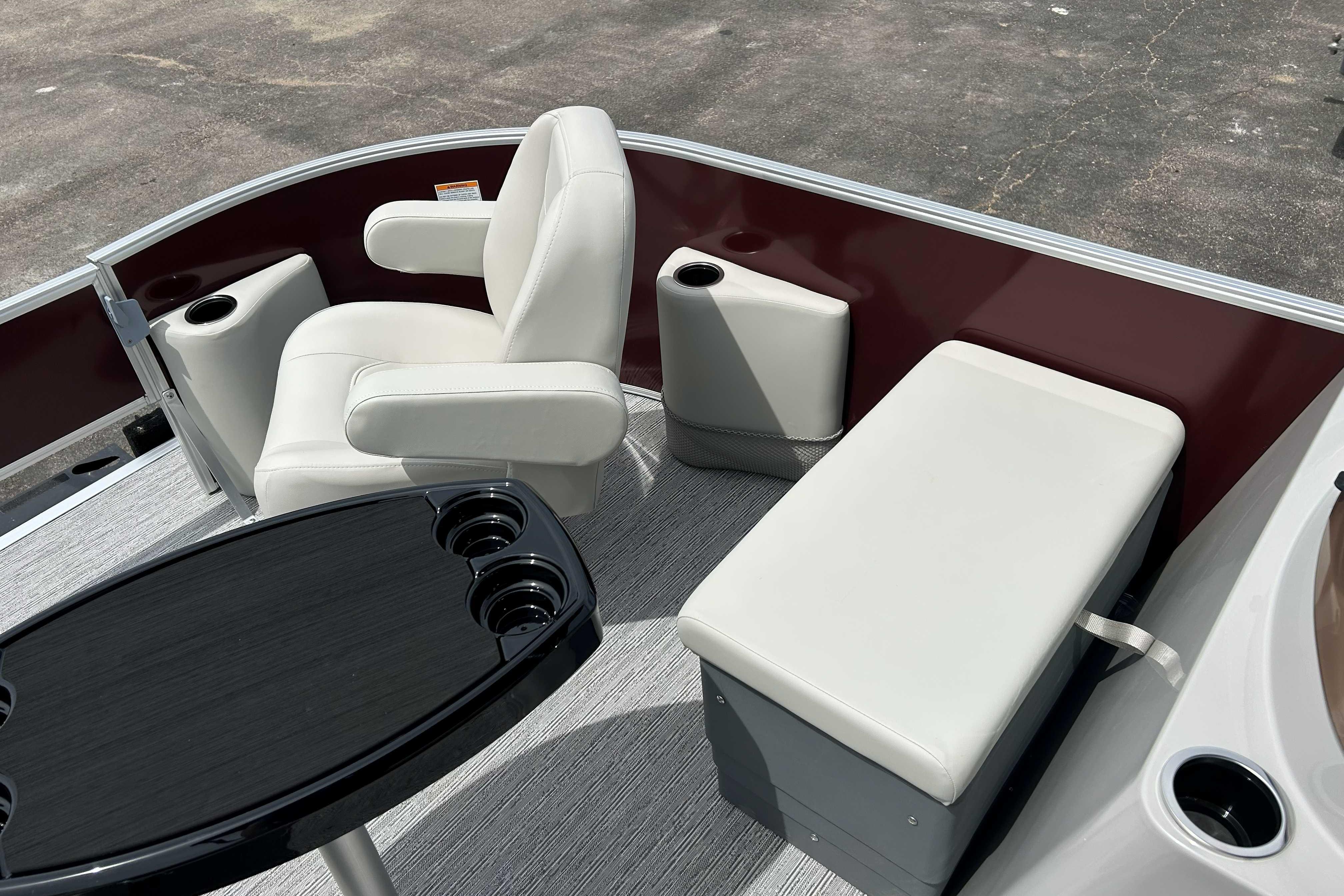 2026 Starcraft EX 20 F boat interior with white seating and cup holders.