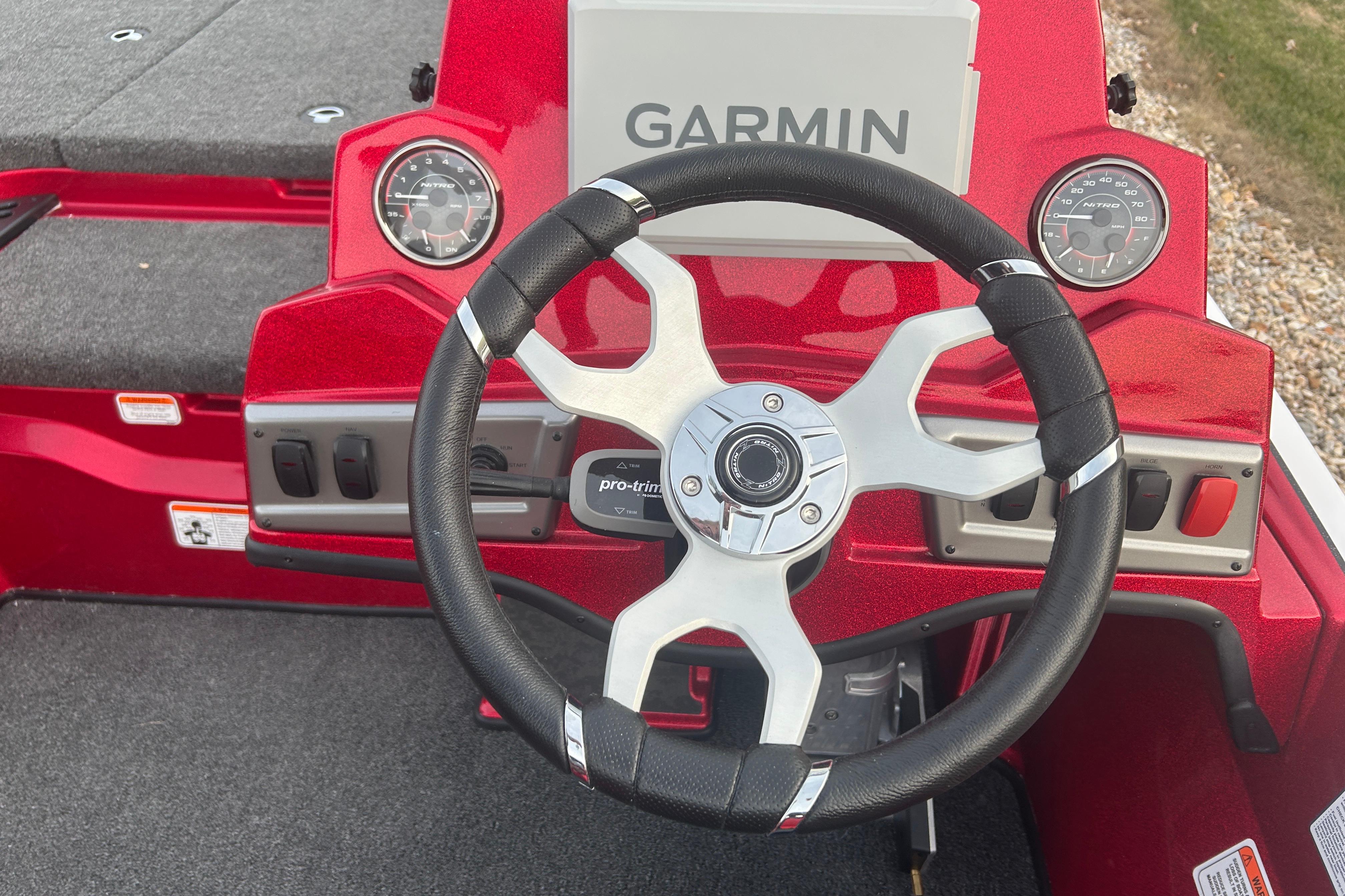 2026 Nitro Z19 XL Pro boat dashboard with Garmin display and steering wheel.