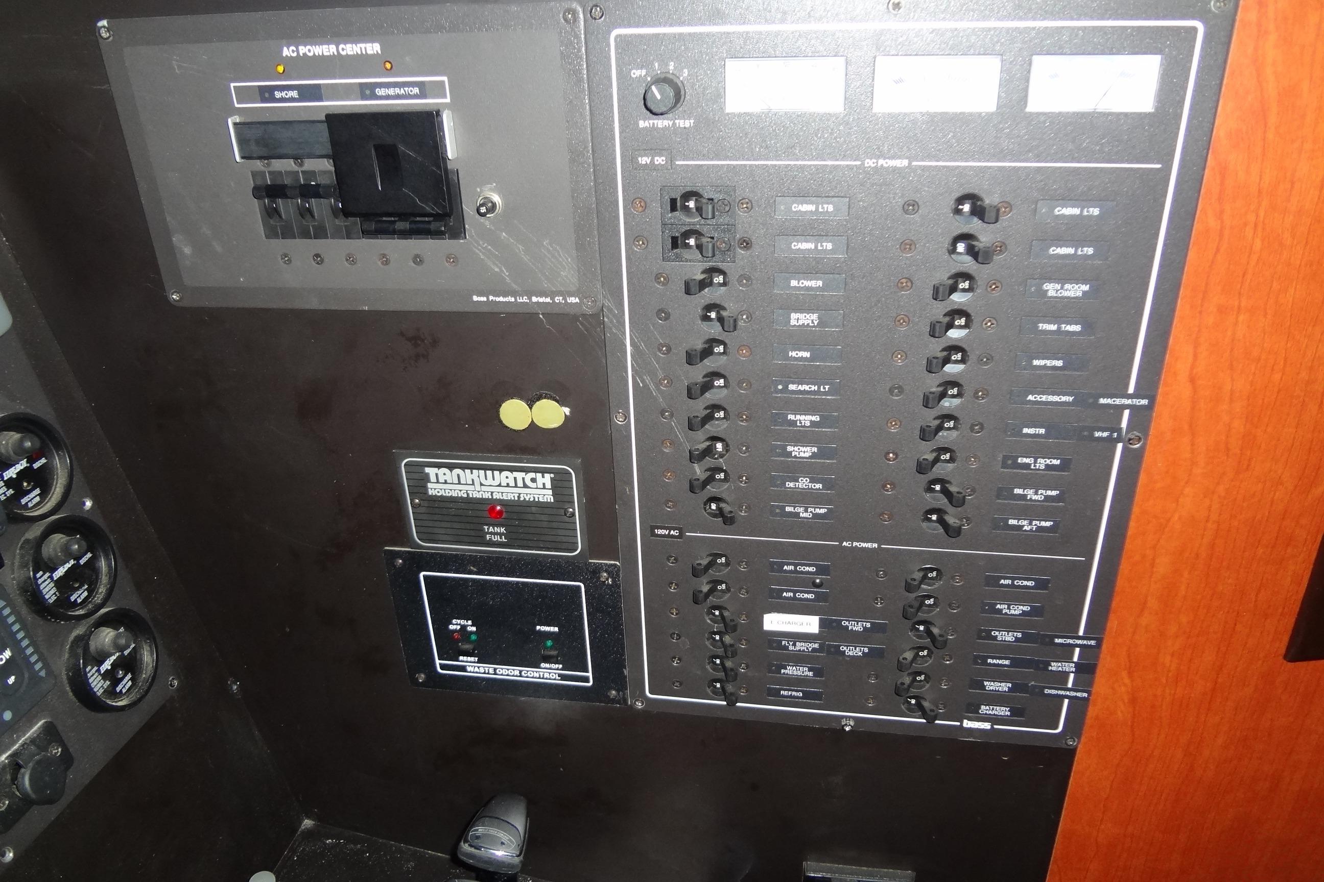 Control panel of 2008 Bluewater 5200 Signature Edition boat, featuring AC and DC power switches.