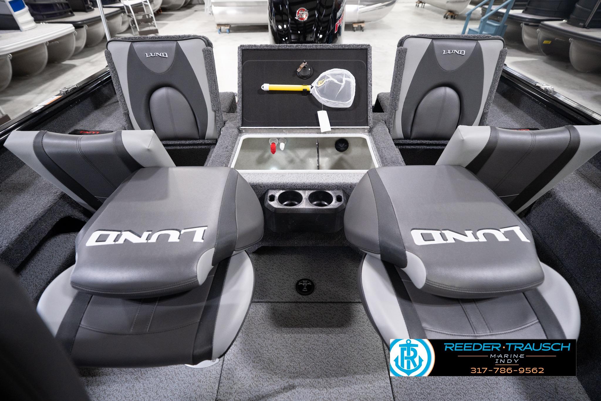 2026 Lund 1775 Impact XS SS boat interior with seating and storage compartments.
