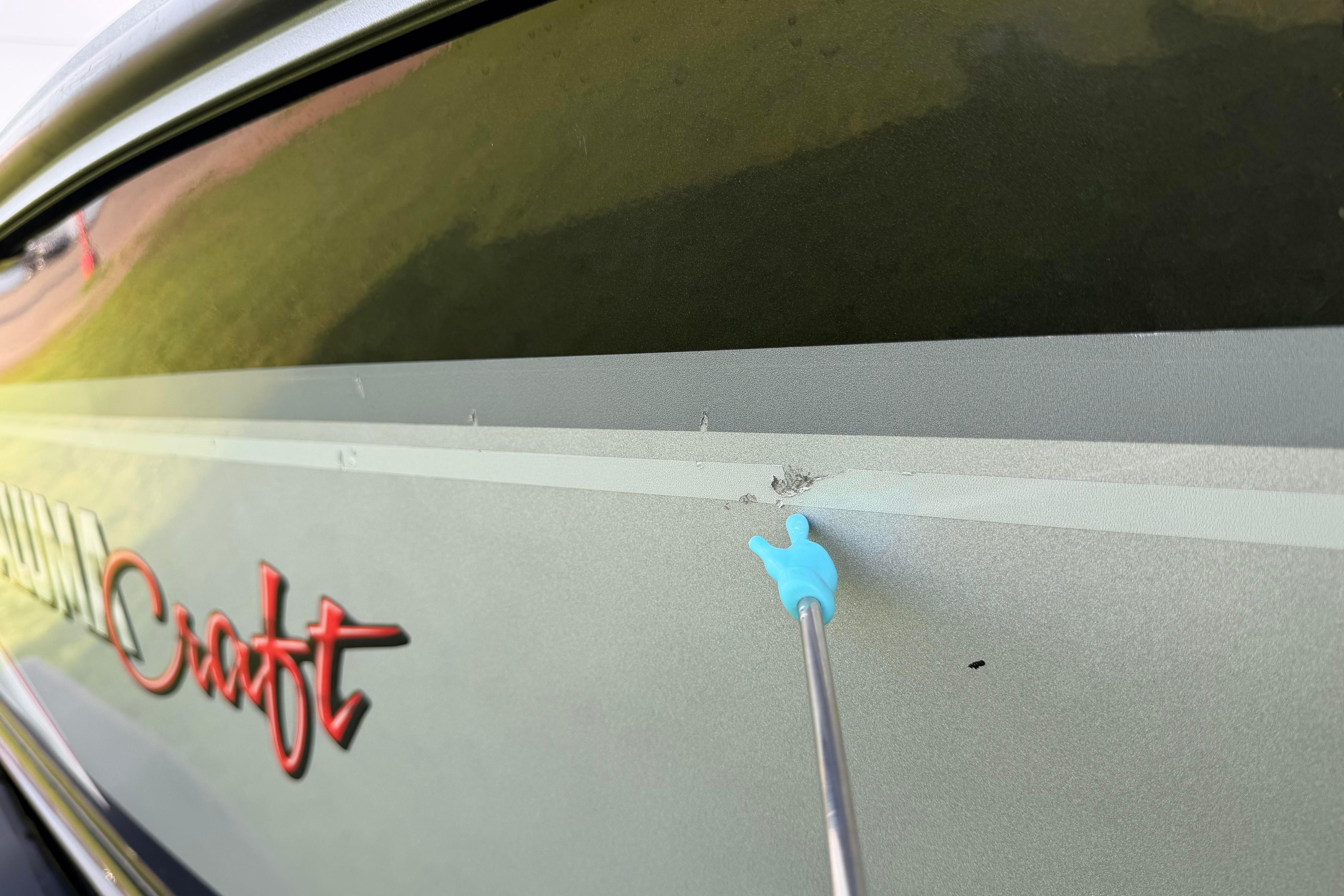 2019 Alumacraft Trophy 205 boat with minor hull damage highlighted.