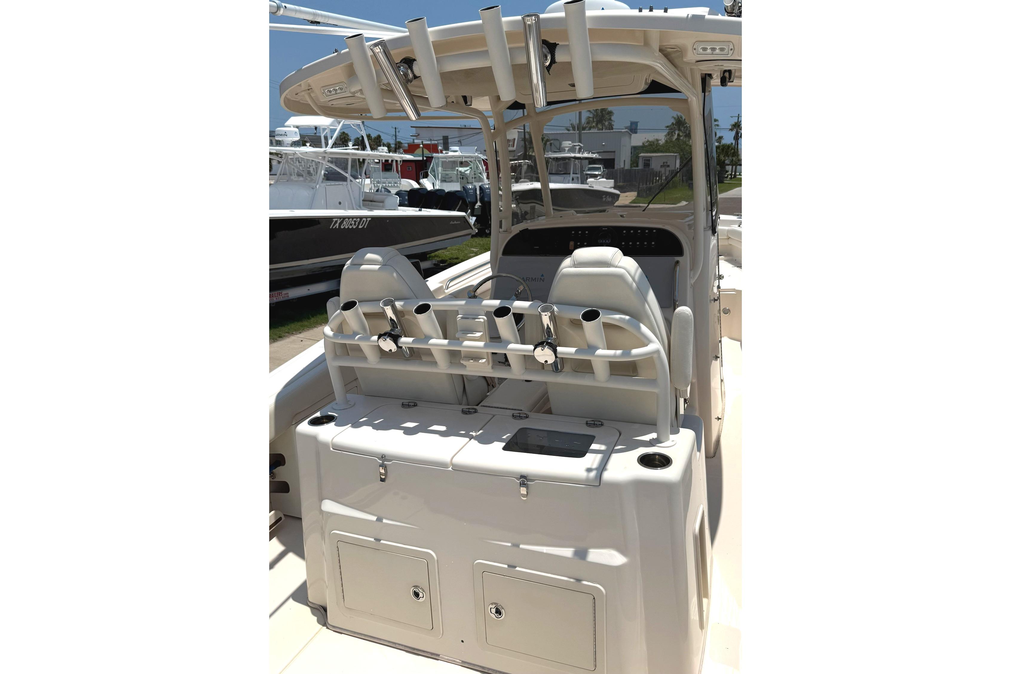 2018 Grady-White Canyon 306 boat interior with rod holders and seating.