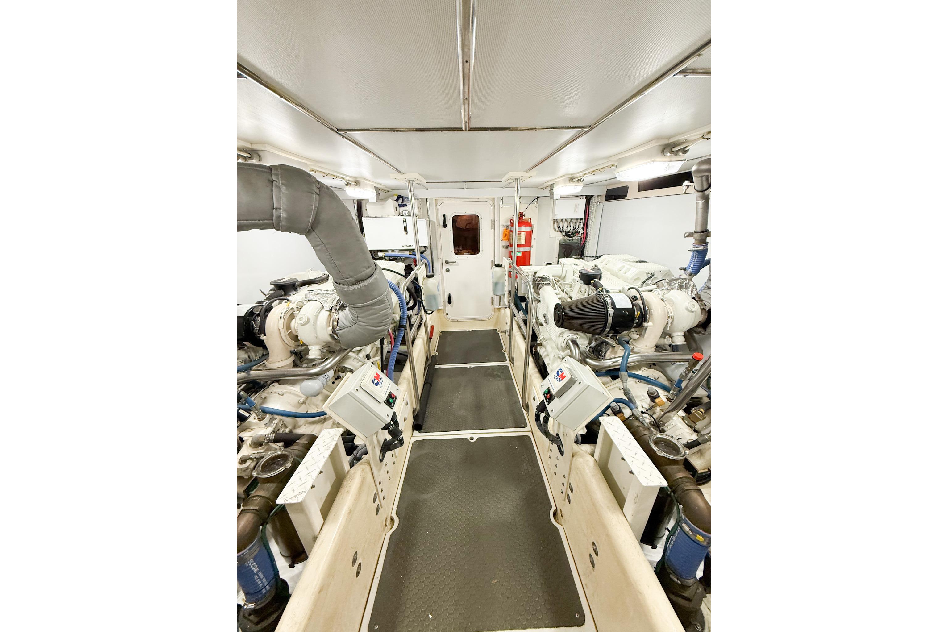 Engine room of a 2007 Nordic Tug 54, featuring dual engines and control panels.
